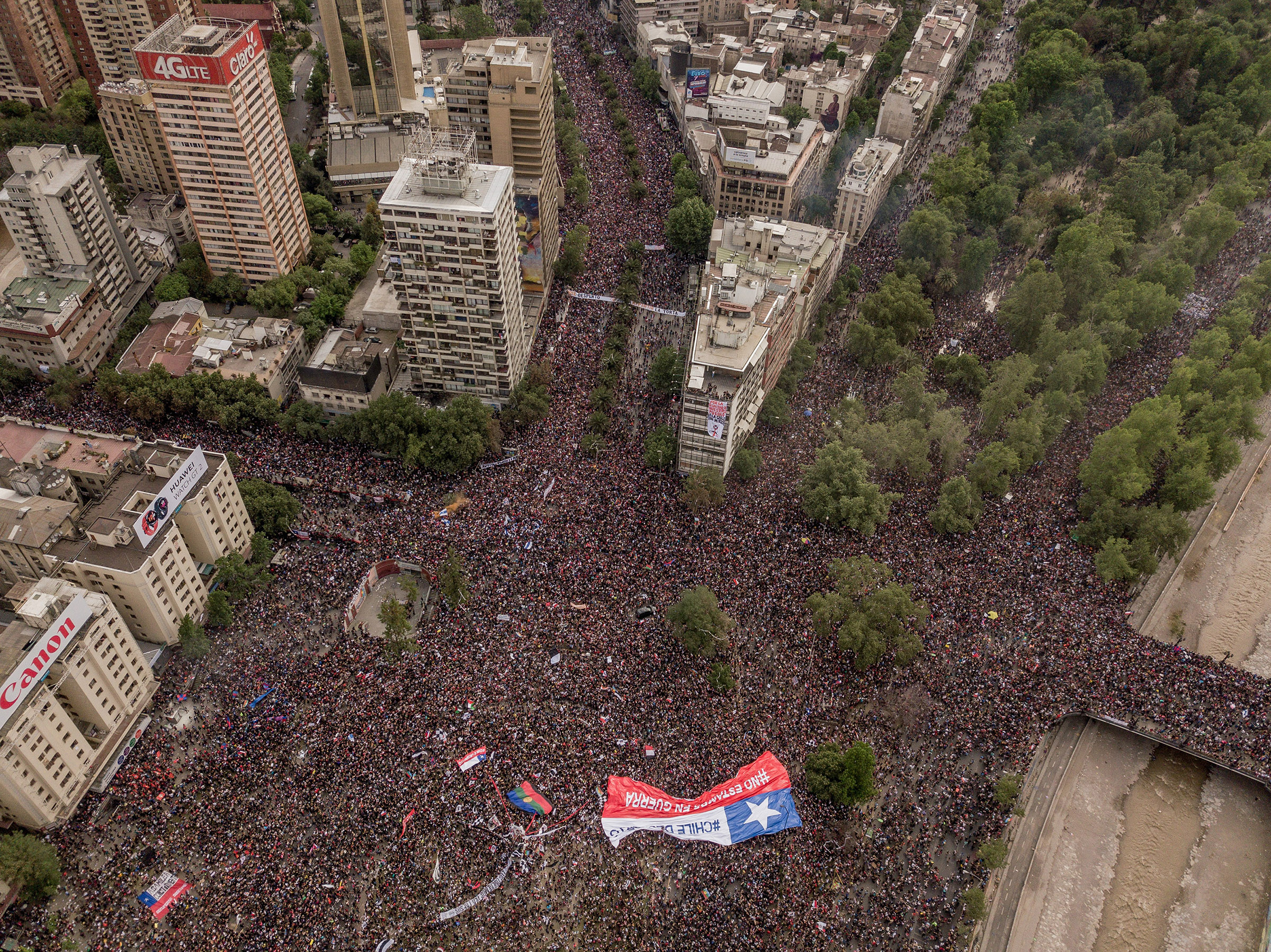 Protesters take to the streets in Santiago, Chile, on Oct. 25, 2019. (Tomas Munita—The New York Times/Redux)