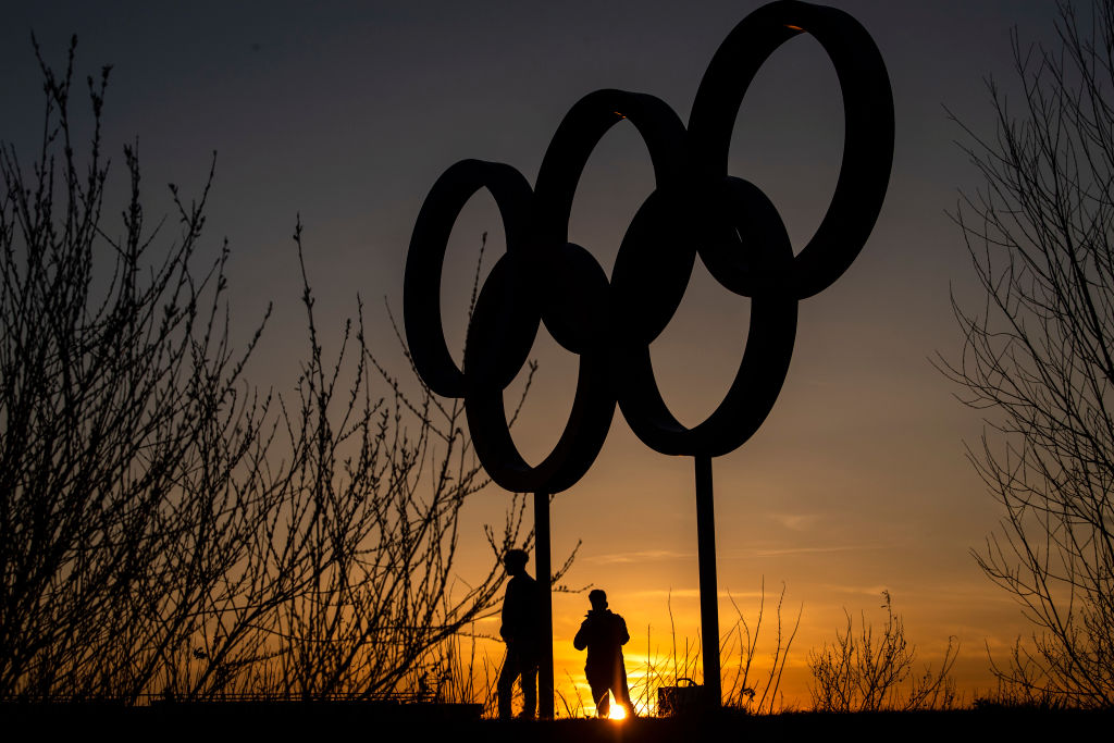 The Olympic rings are seen as sunset in the Olympic Park in Stratford