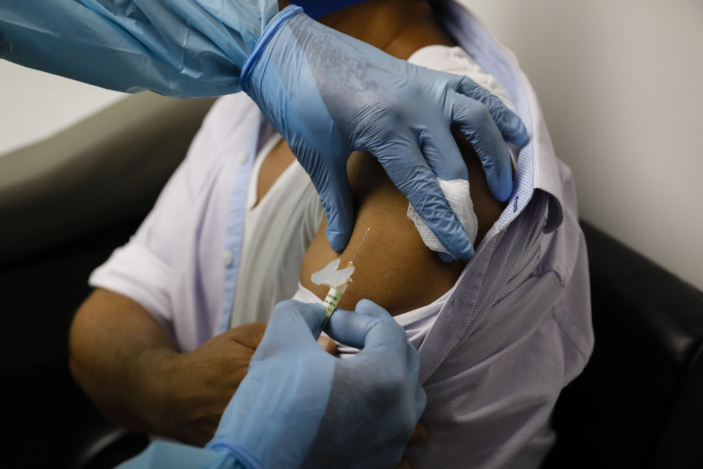 A health worker injects a person during clinical trials for a Covid-19 vaccine at Research Centers of America in Hollywood, Florida on Sept. 9, 2020. (Eva Marie Uzcategui/Bloomberg—Getty Images)
