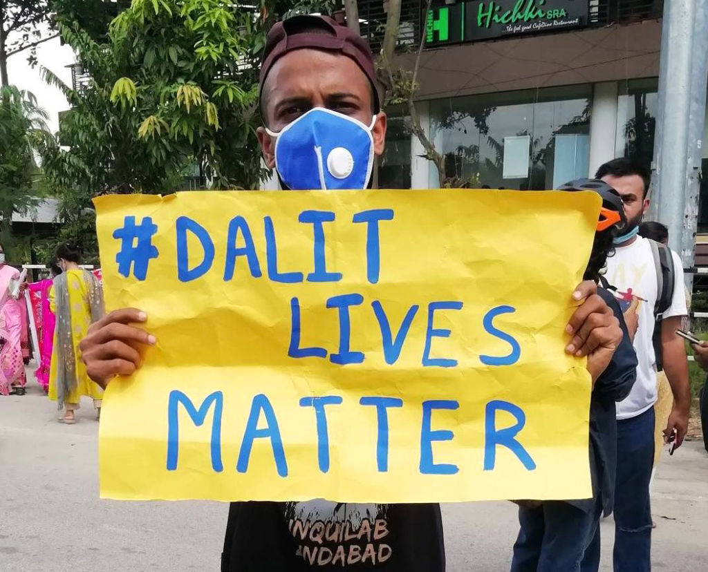 A protester holds a sign reading "Dalit Lives Matter" at a protest against the Hathras gang rape, in Guwahati, Assam, India on October 3, 2020. (David Talukdar—NurPhoto/Getty Images)