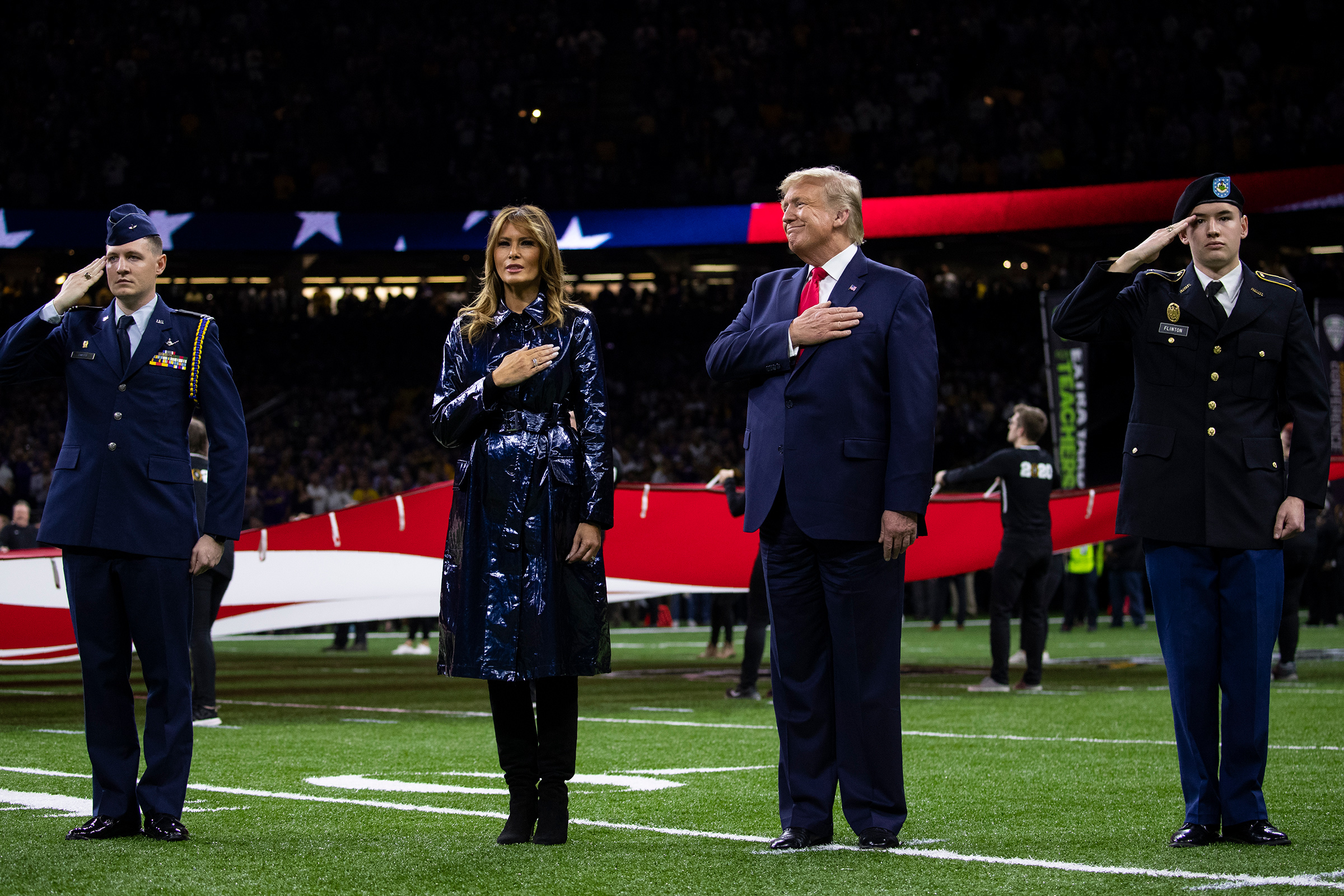President Donald Trump and first lady Melania Trump stand for the national anthem before the beginning of the College Football Playoff National Championship game on Jan. 13 in New Orleans (Evan Vucci—AP)