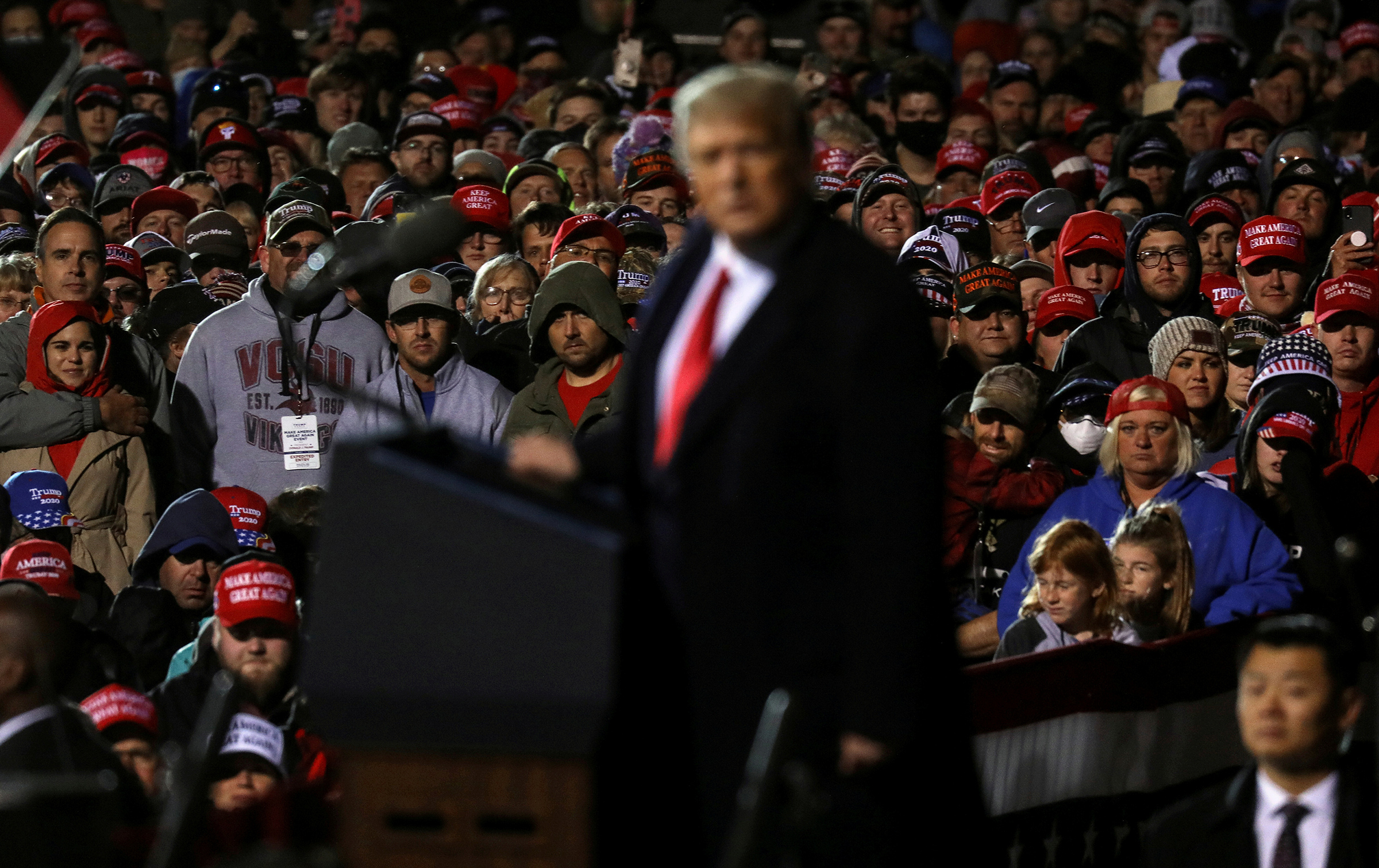 Supporters of President Donald Trump look on as he speaks during a campaign rally at Duluth International Airport on Sept. 30, 2020. (Leah Millis—Reuters)