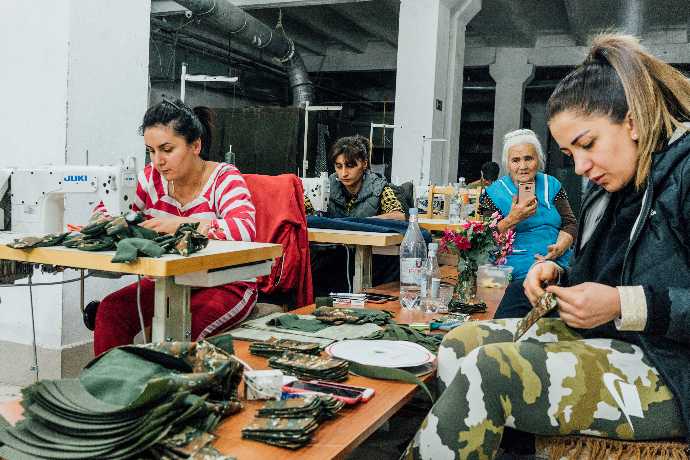 Armenian volunteers in Stepanakert sew uniforms and sleeping bags for soldiers on the frontline. (Emanuele Satolli)