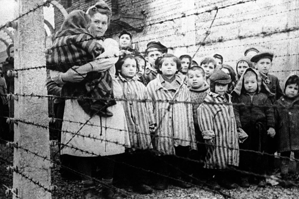 Children photographed inside the Auschwitz concentration camp on January 27, 1945. (TASS via Getty Images)
