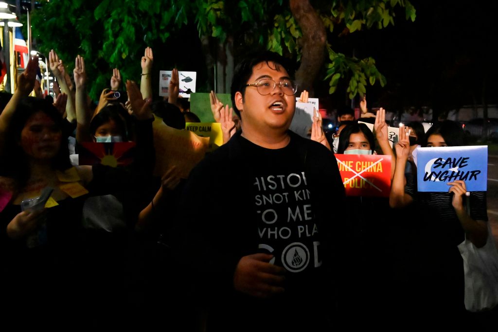 sings during a Milk Tea Alliance protest outside the Chinese embassy in Bangkok on Oct. 1, 2020. (Romeo GACAD—AFP/Getty Images Bunkueanun “Francis” Paothong)