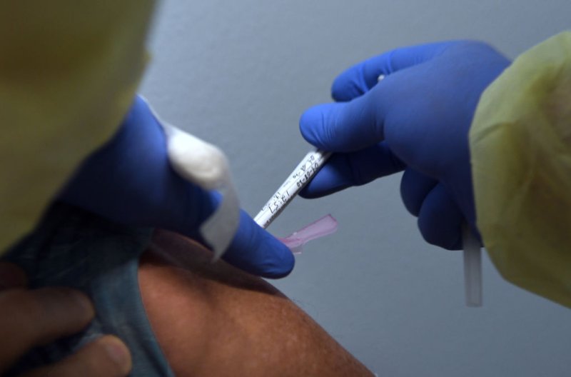 Tony Potts, a 69-year-old retiree living in Ormond Beach, receives his first injection as a participant in a Phase 3 COVID-19 vaccine clinical trial sponsored by Moderna at Accel Research Sites in DeLand, Florida on Aug. 4, 2020.