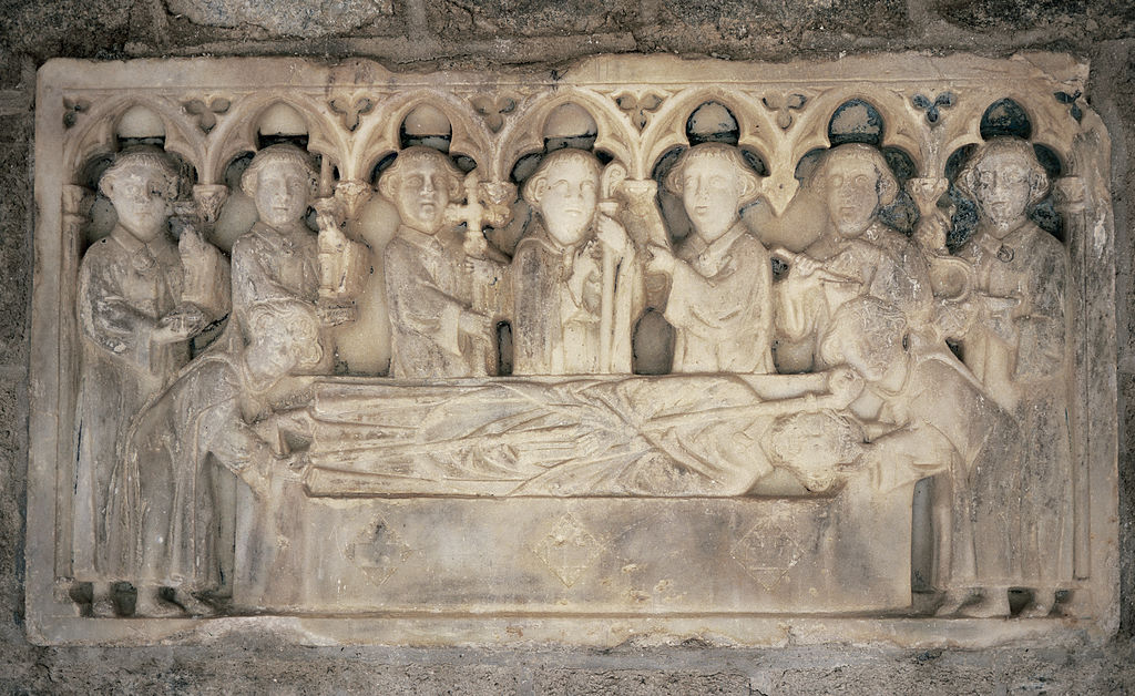 Martin-du-Canigou. Tombstone. Reliefs represent: The funeral procession. 14th century. Cloister of the Monastery. Gothic style. France.