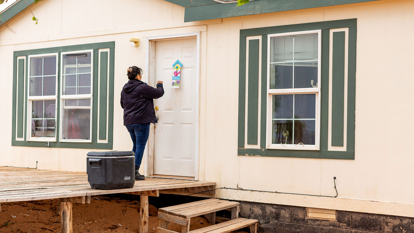 Tara Benally, a field director for Rural Arizona Project, conducts door-knocking efforts on the Navajo Nation as a part of a voter registration program in 2019. (Madeline McGill/Rural Utah Project)