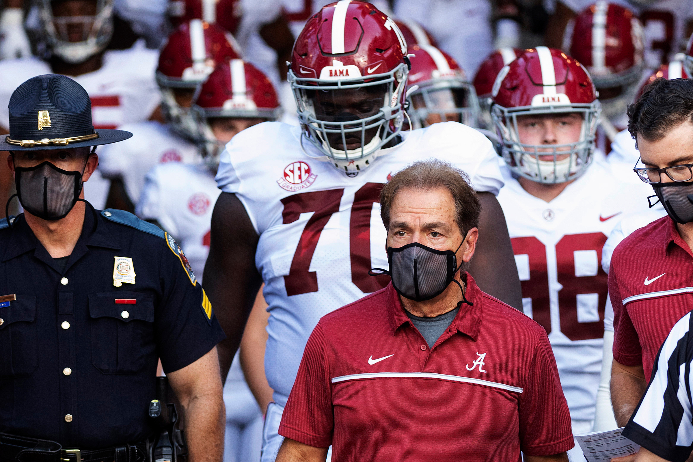 Alabama coach Nick Saban leads his team to the field before an NCAA college football game against Missouri in Columbia, Mo., on Sept. 26, 2020. Saban and athletic director Greg Byrne tested positive for COVID-19, days before the Southeastern Conference's biggest regular-season showdown.