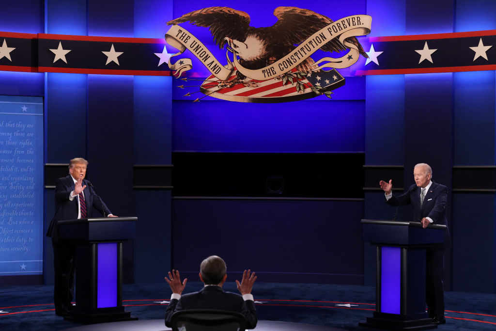U.S. President Donald Trump and Democratic presidential nominee Joe Biden participate in the first presidential debate moderated by Fox News anchor Chris Wallace (C) at the Health Education Campus of Case Western Reserve University on September 29, 2020 in Cleveland, Ohio. (Scott Olson—Getty Images)