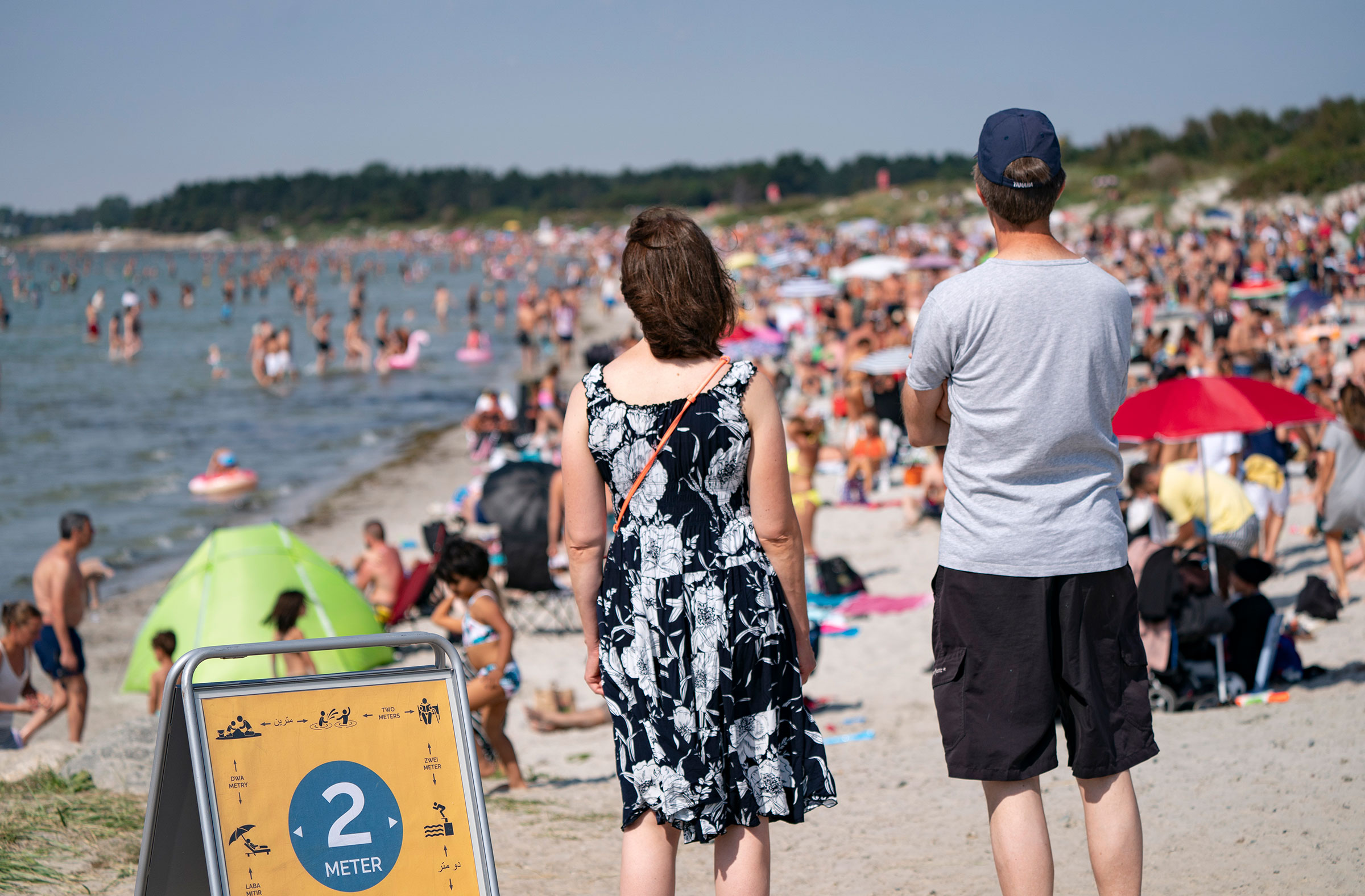 People on a crowded beach in Lomma, Sweden on Aug. 16, 2020. (Johan Nilsson—TT/Sipa)