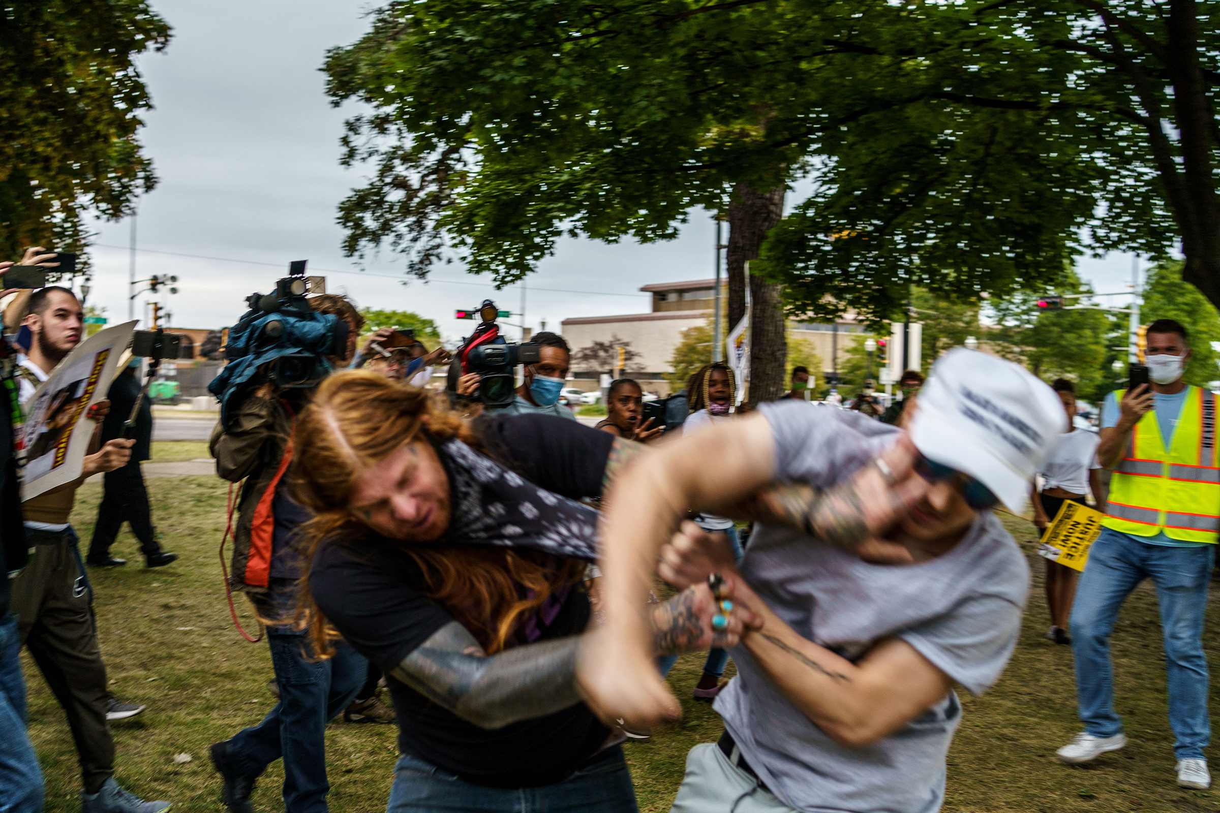A protester scuffles with a Trump supporter (R) in Kenosha, Wis. on Sept. 1 amid ongoing demonstrations after the shooting by police of Jacob Blake