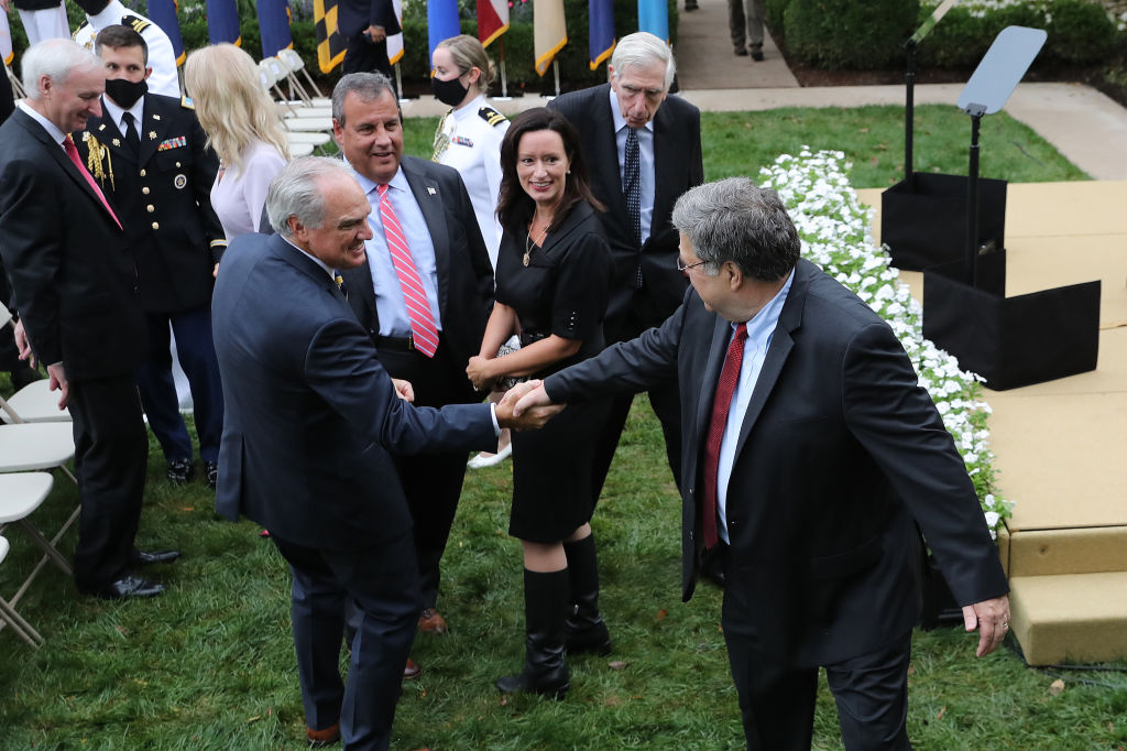 Attorney General William Barr says goodbye to former New Jersey Governor Chris Christie and other guests after President Donald Trump introduces 7th U.S. Circuit Court Judge Amy Coney Barrett, 48, as his nominee to the Supreme Court in the Rose Garden at the White House September 26, 2020 in Washington, DC. (Photo by Chip Somodevilla/Getty Images)