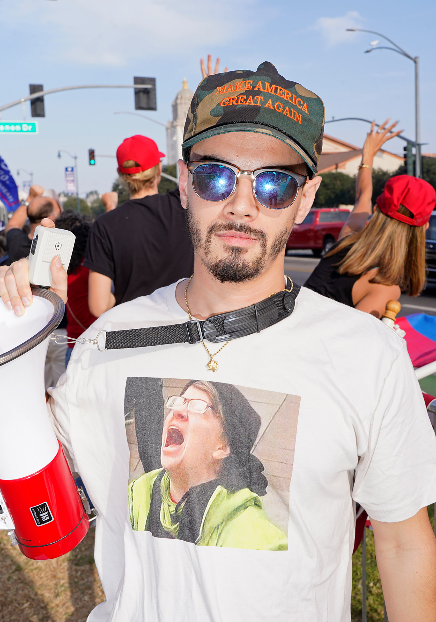 A man at a pro-Trump rally in Beverly Hills, Calif., on Nov. 3 wears a shirt printed with an image from 2016 of a woman crying after learning that Hillary Clinton had lost the election. (Jamie Lee Curtis Taete)