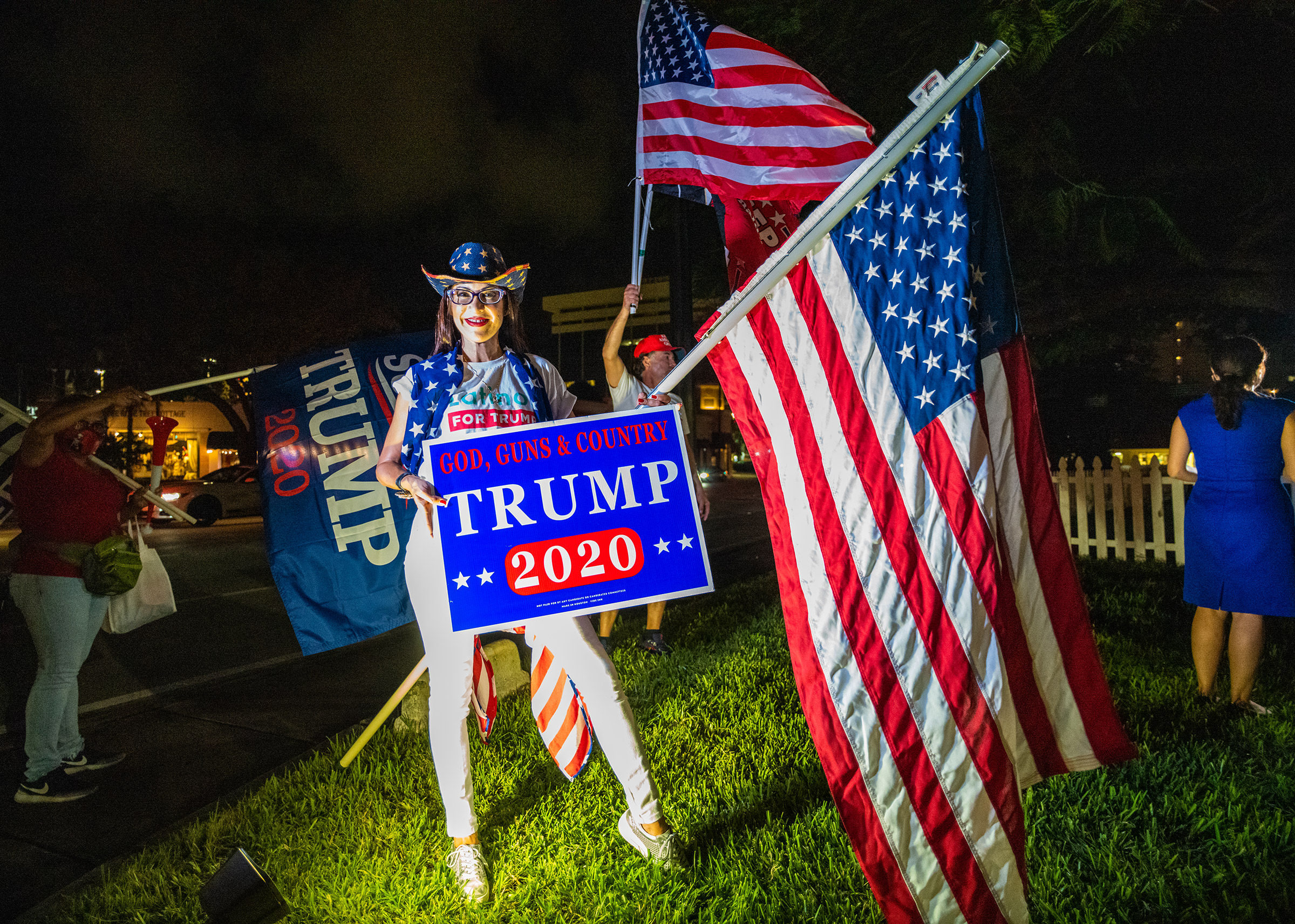 A supporter of President Trump poses for a photograph in Miami on Nov. 7. (Ruddy Roye for TIME)