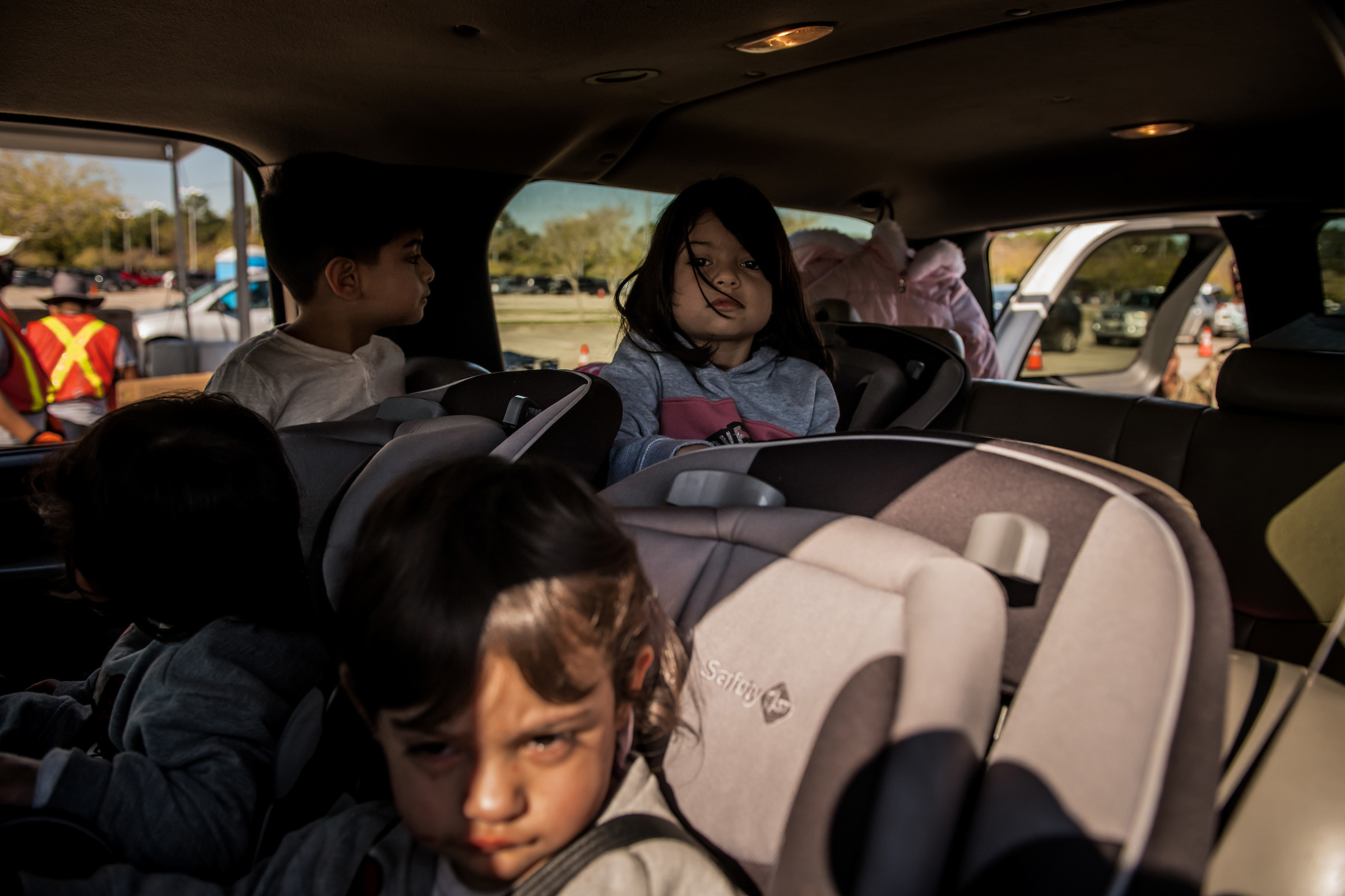 Children at the food distribution site run by the Houston Food Bank. (Meridith Kohut for TIME)
