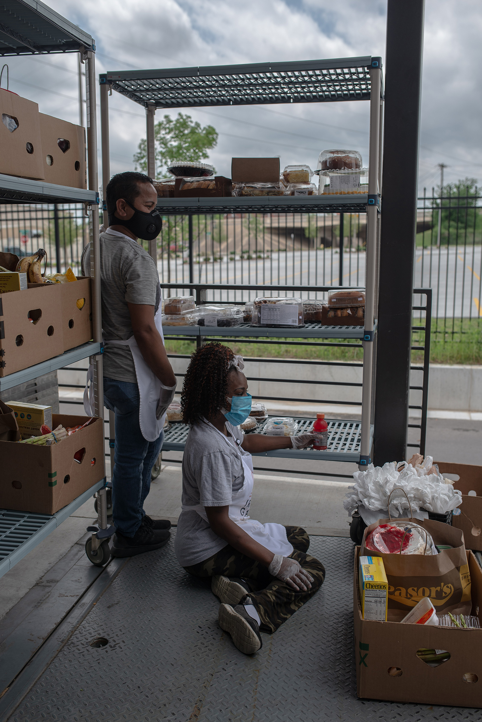 Workers at the Iron Gate drive-through food pantry in Tulsa on April 7. (September Dawn Bottoms for TIME)