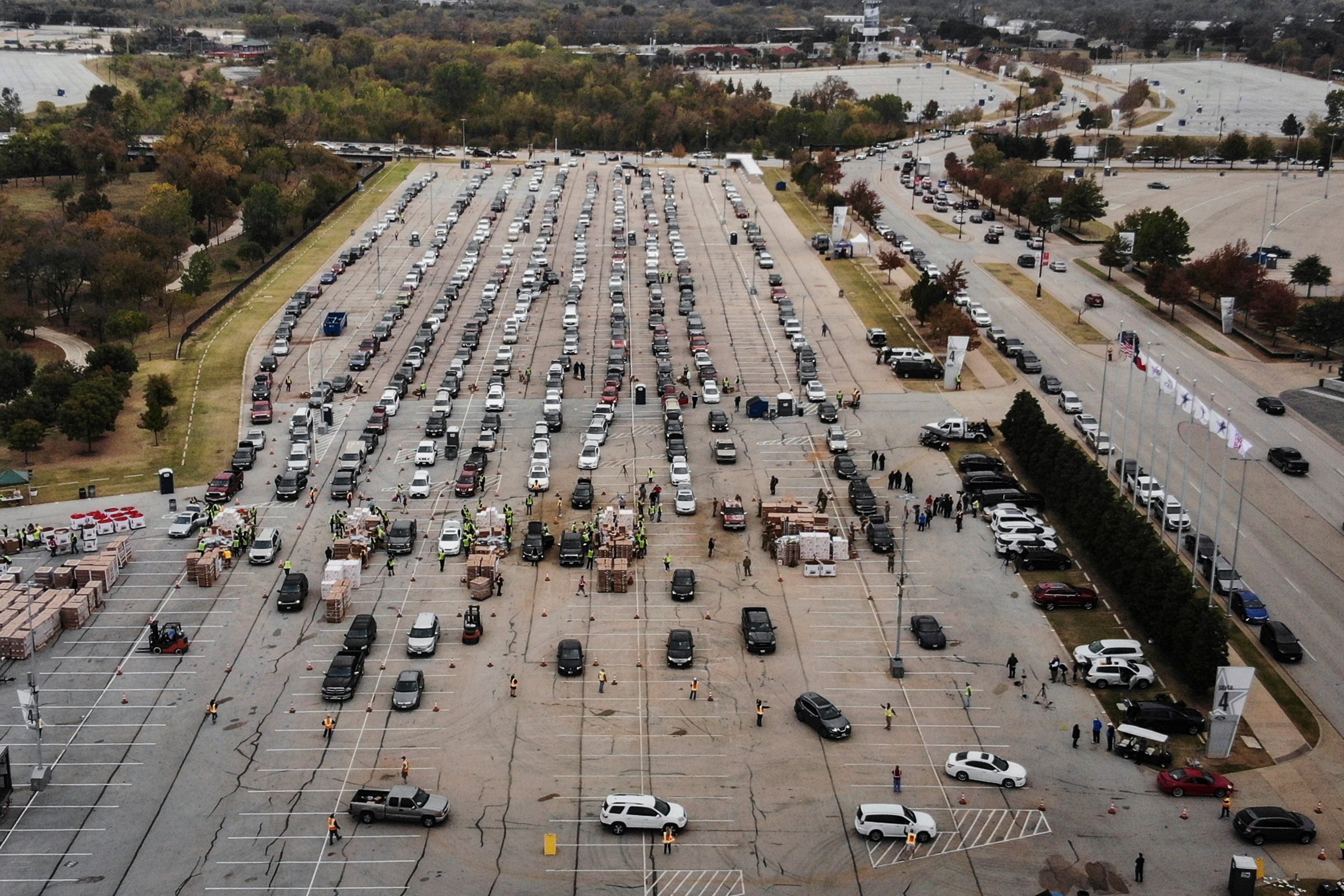 People line up in their cars to receive Thanksgiving meal boxes, which include a turkey and pantry items, from the Tarrant Area Food Bank in Arlington, Texas, on Nov. 20. (Yffy Yossifor—Star-Telegram/AP)