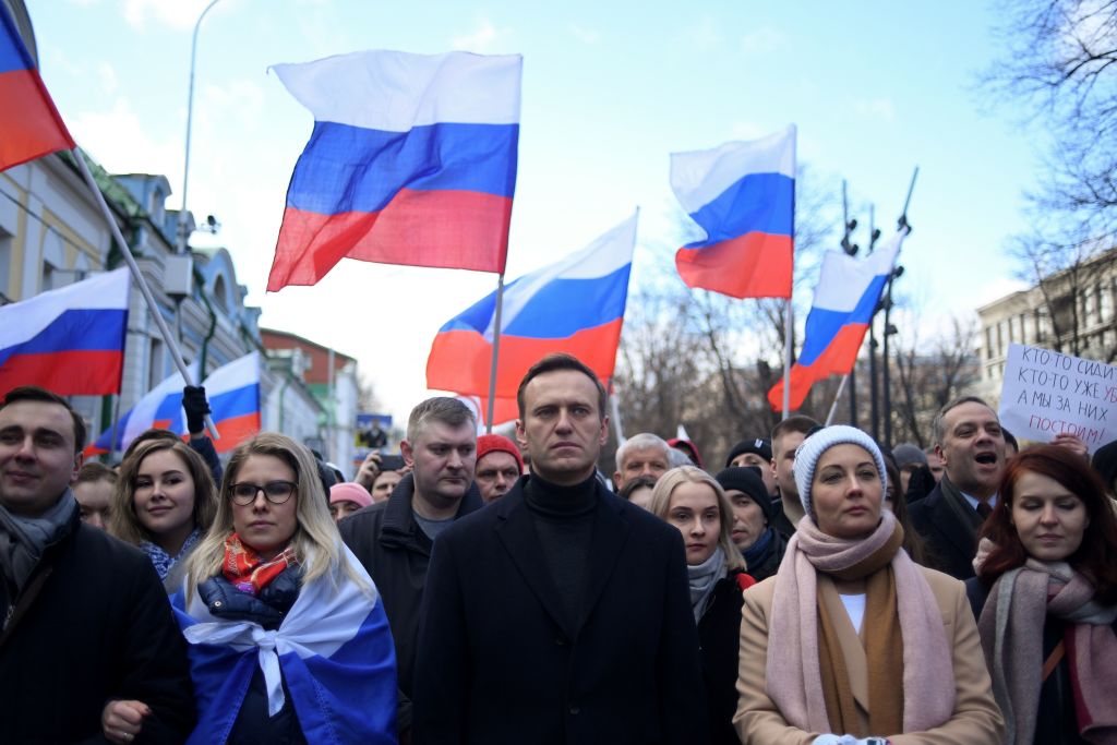 Russian opposition leader Alexei Navalny, his wife Yulia, opposition politician Lyubov Sobol and other demonstrators march in memory of murdered Kremlin critic Boris Nemtsov in downtown Moscow on February 29, 2020. (Kirill Kudryavtsev — AFP via Getty Images)