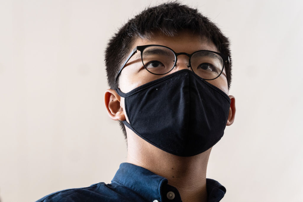 Joshua Wong, activist, speaks with members of the media outside the West Kowloon Magistrates' Courts in Hong Kong, China, on Monday, Nov. 23, 2020. (Chan Long Hei/Bloomberg via Getty Images)