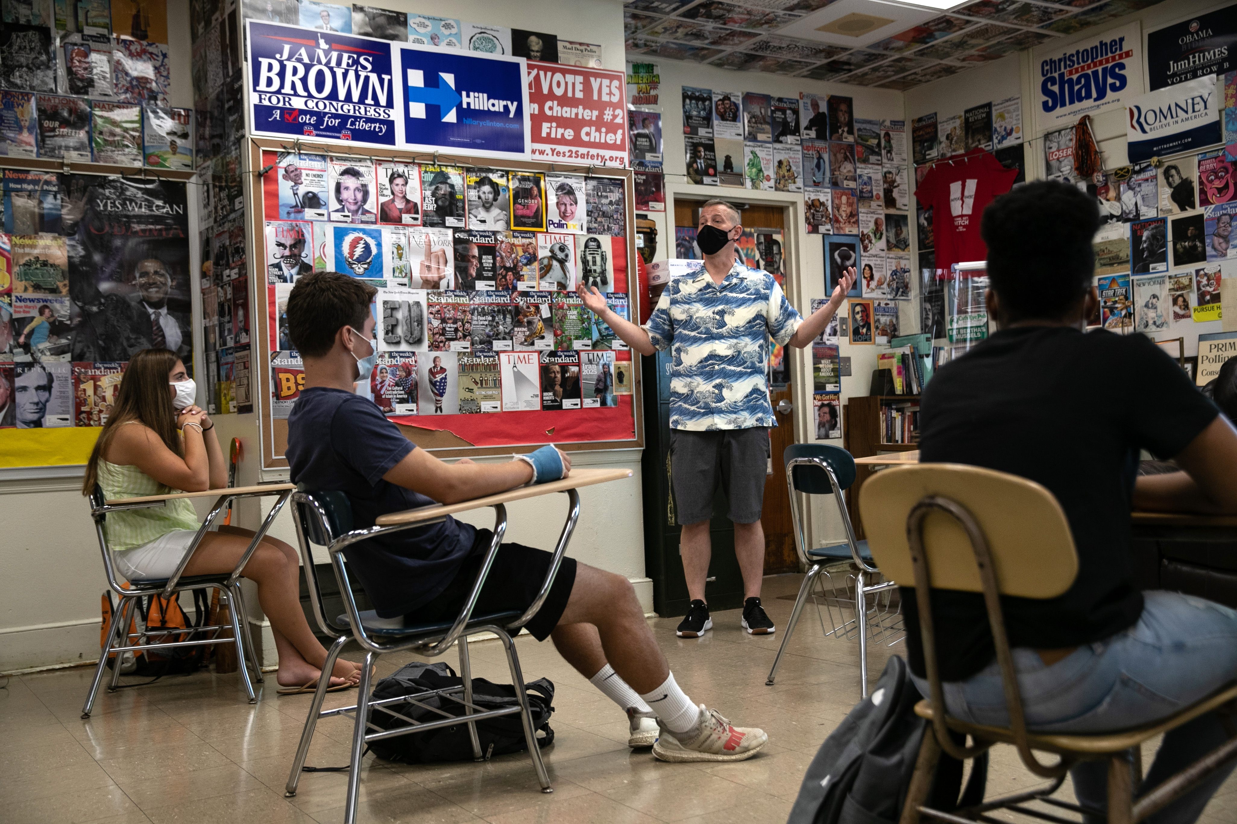 Honors civics teacher Mike Brown discusses the U.S. presidential election with masked students on the first day of school at Stamford High School on Sept. 8, 2020 in Stamford, Connecticut. (John Moore—Getty Images)