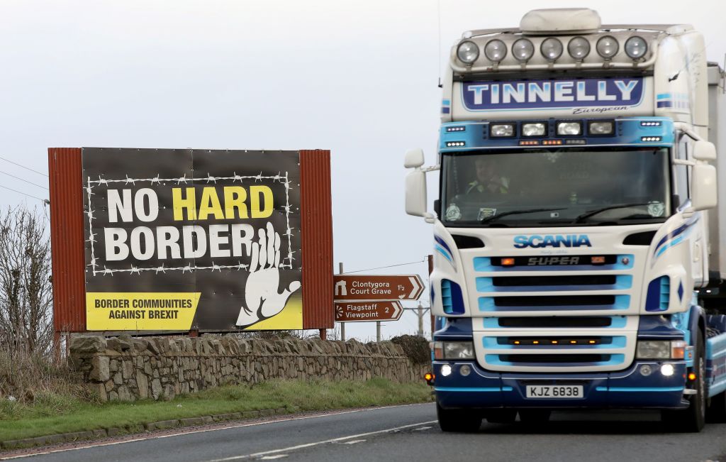 Traffic passes an 'No Hard Border' anti-Brexit, pro-Irish unity billboard poster as it crosses the border road between Newry in Northern Ireland, on February 1, 2020, in  Dundalk, Ireland. (Paul Faith—AFP via Getty Images)