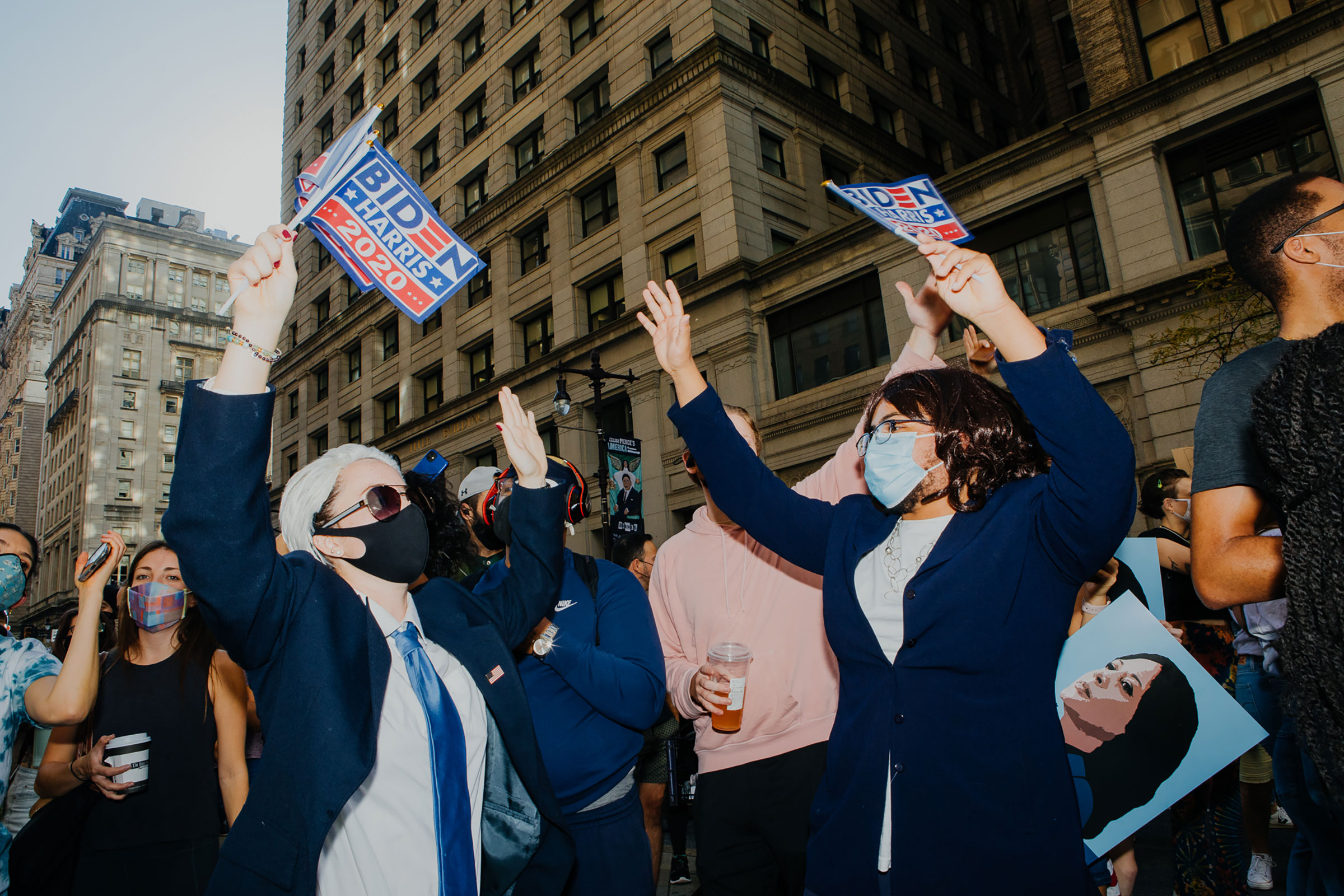 Katelyn Barbour, dressed as President-Elect Joe Biden, and Justin Procope, dressed as Vice President-Elect Kamala Harris, celebrate on Broad Street in downtown Philadelphia on Nov. 7, 2020. (Michelle Gustafson for TIME)