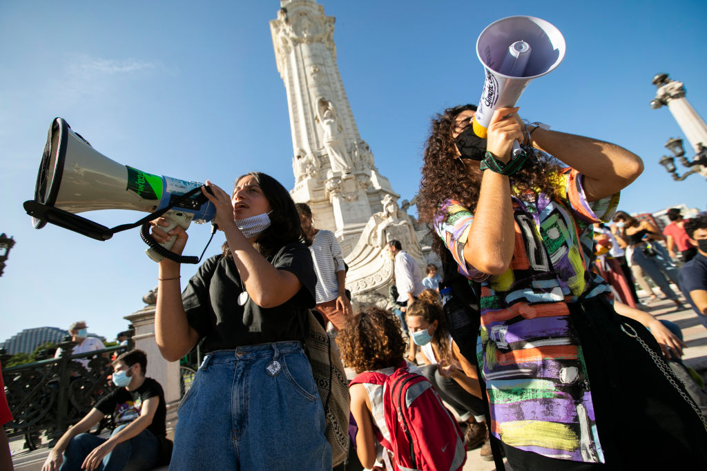 Protesters shouting slogans on megaphones during the climate