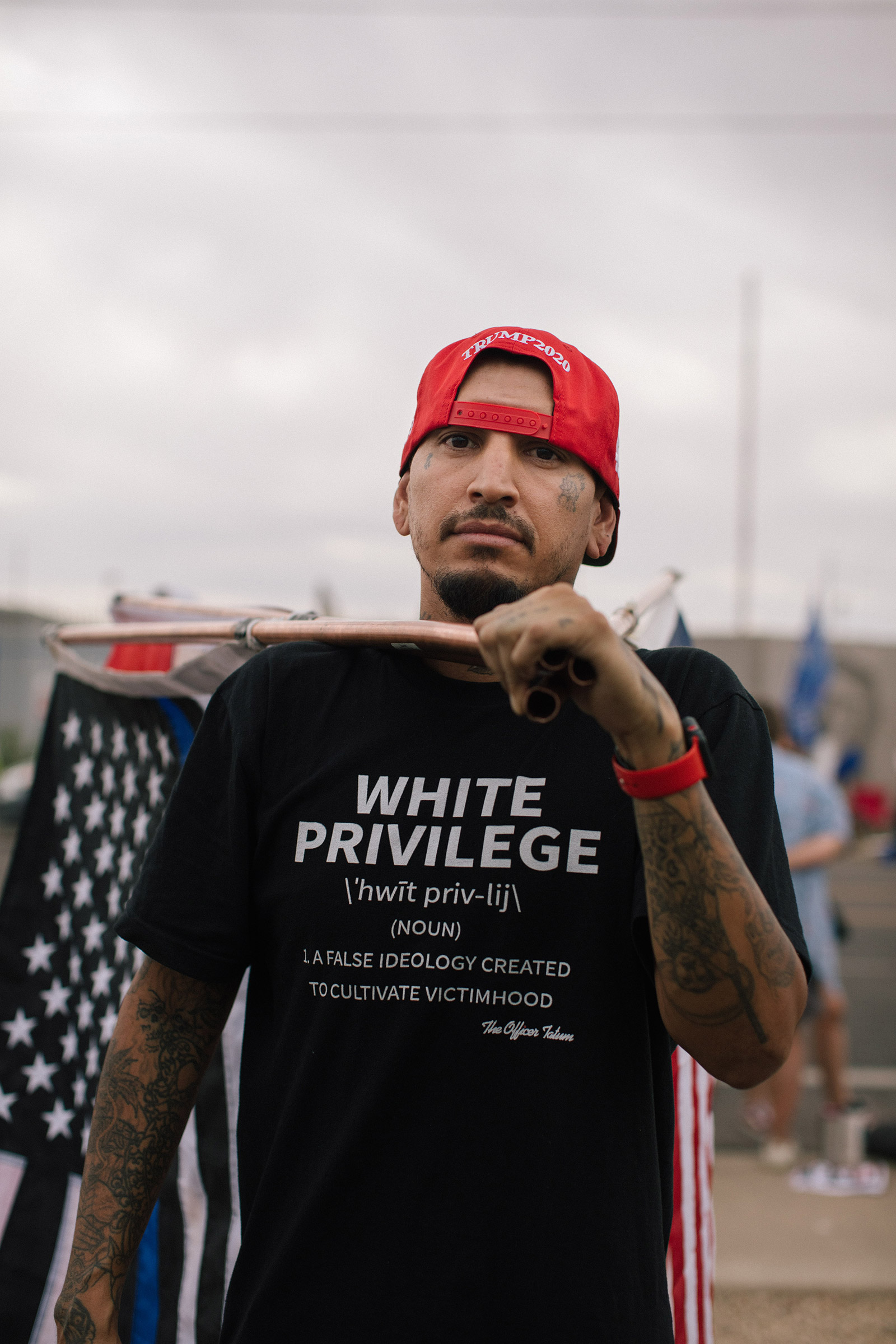 A man wears a white privilege shirt at the Maricopa County Elections Department office in Phoenix, AZ on November 6, 2020
