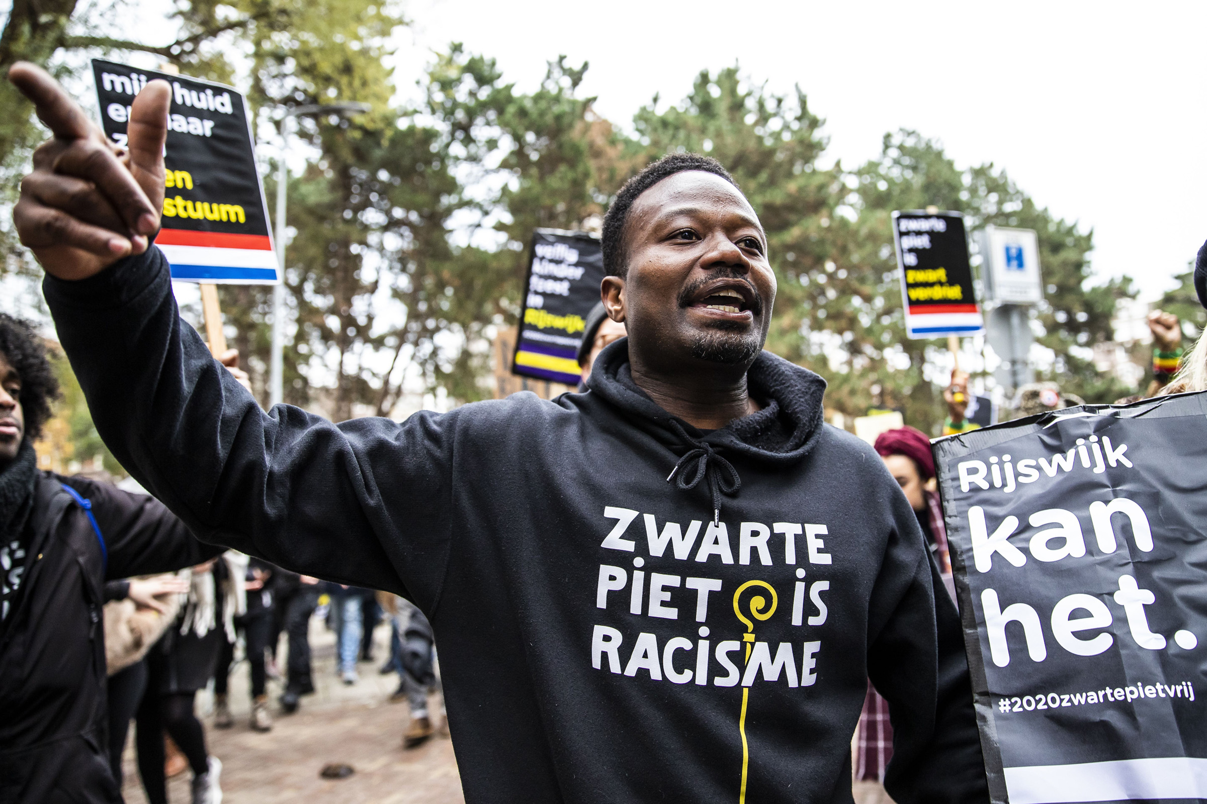 Dutch anti-discrimination activist Jerry Afriyie (C), leader of the 'Kick Out Zwarte Piet' (Kick Out Black Pete) movement, during a protest in Rijswijk, the Netherlands, on Nov. 23, 2019. (Lauren van Putten—Hollandse Hoogte/Redux)