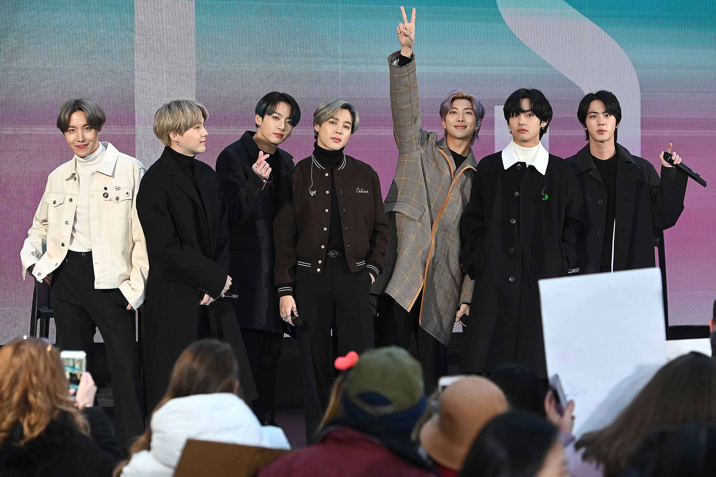 BTS members are seen onstage during a live interview on NBC's TODAY show at Rockefeller Plaza in New York City, Feb. 21 (Anthony Behar—Sipa USA/AP)