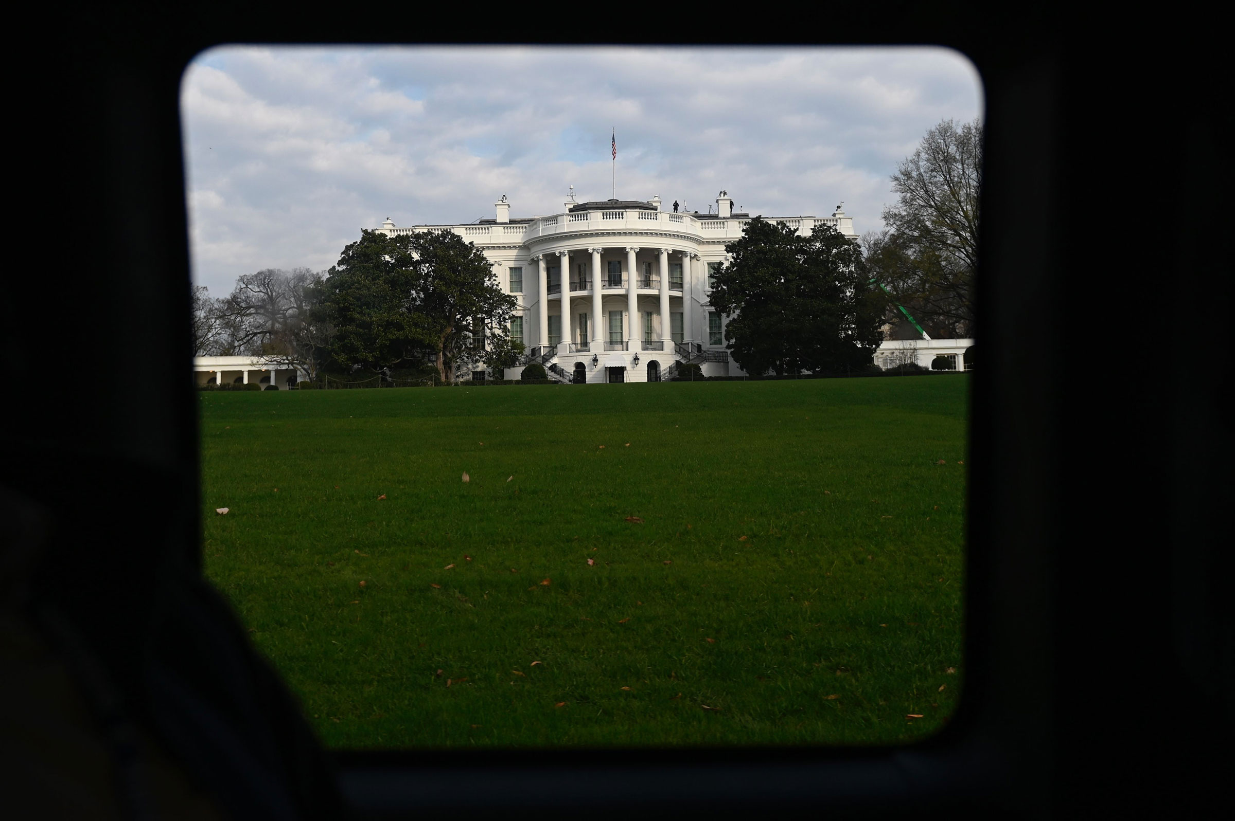 The White House is seen through a vehicle in the presidential motorcade in Washington, on Nov. 21, 2020. (Andrew Caballero-Reynolds—AFP/Getty Images)