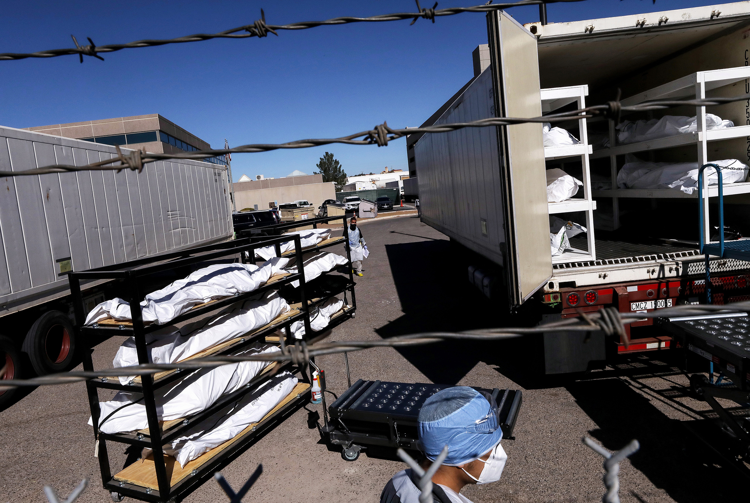 Bodies loaded into a refrigerated temporary morgue trailer in El Paso, Texas, on Nov. 16