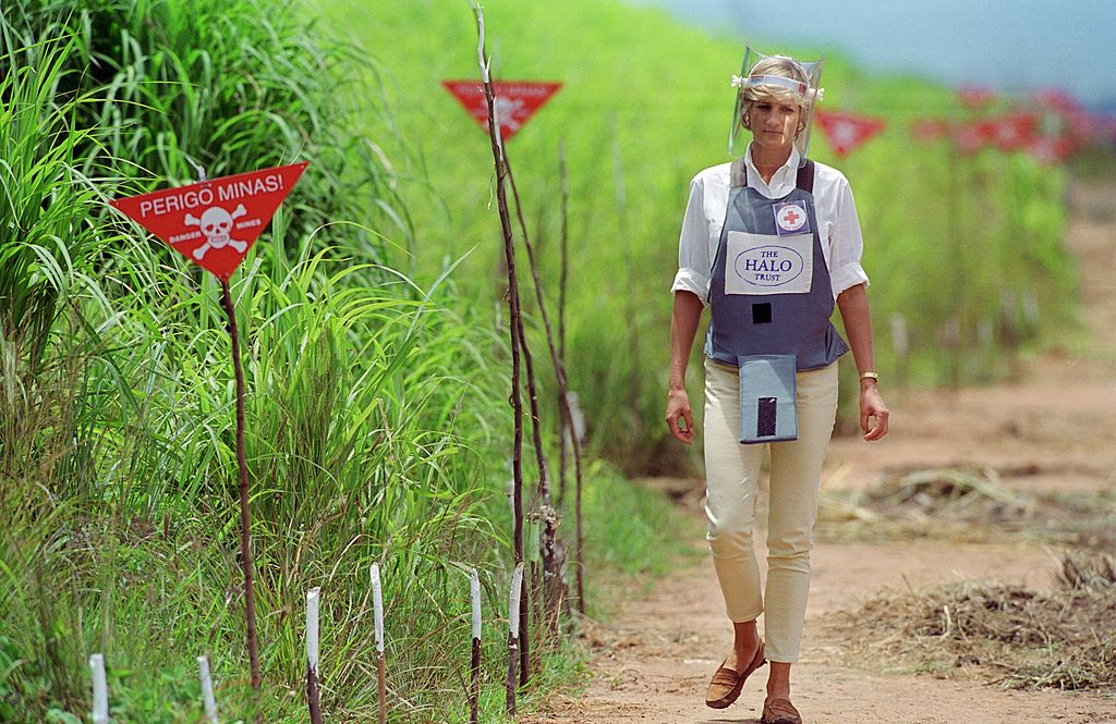 Diana, Princess of Wales wearing protective body armour and a visor visits a landmine minefield being cleared by the charity Halo in Huambo, Angola, on Jan. 15, 1997 (Tim Graham Photo Library via Getty images)