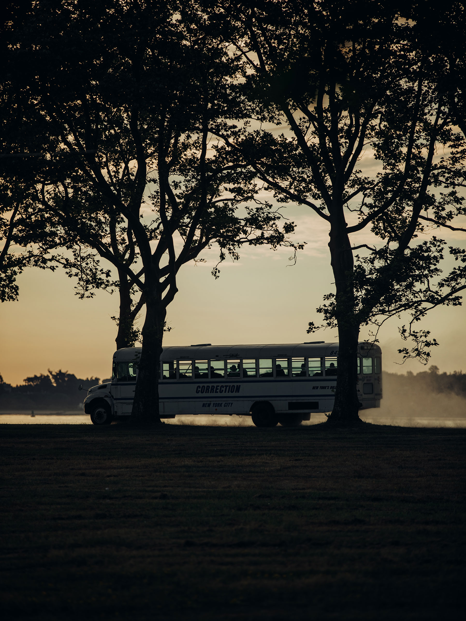 A Department of Correction bus carries workers along Hart Island’s gravel roads. (Sasha Arutyunova for TIME)