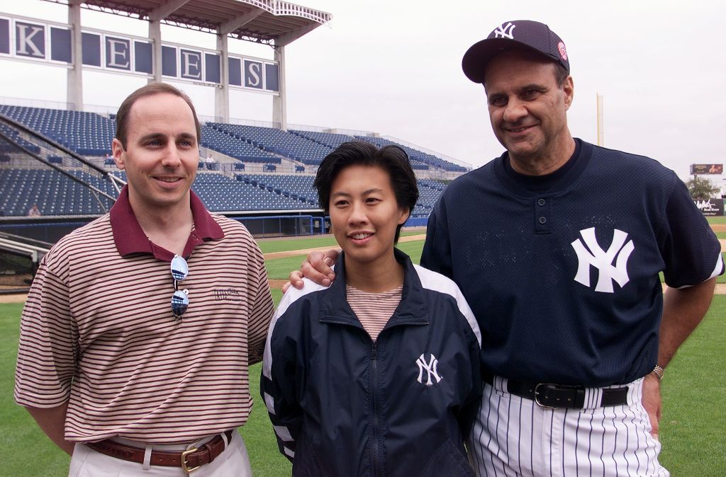 New York Yankees' general manager Brian Cashman, Kim Ng and manager Joe Torre (l. to R.), at announcement of Ng's promotion to vice president and assistant general manager. (Linda Cataffo/NY Daily News Archive via Getty Images)