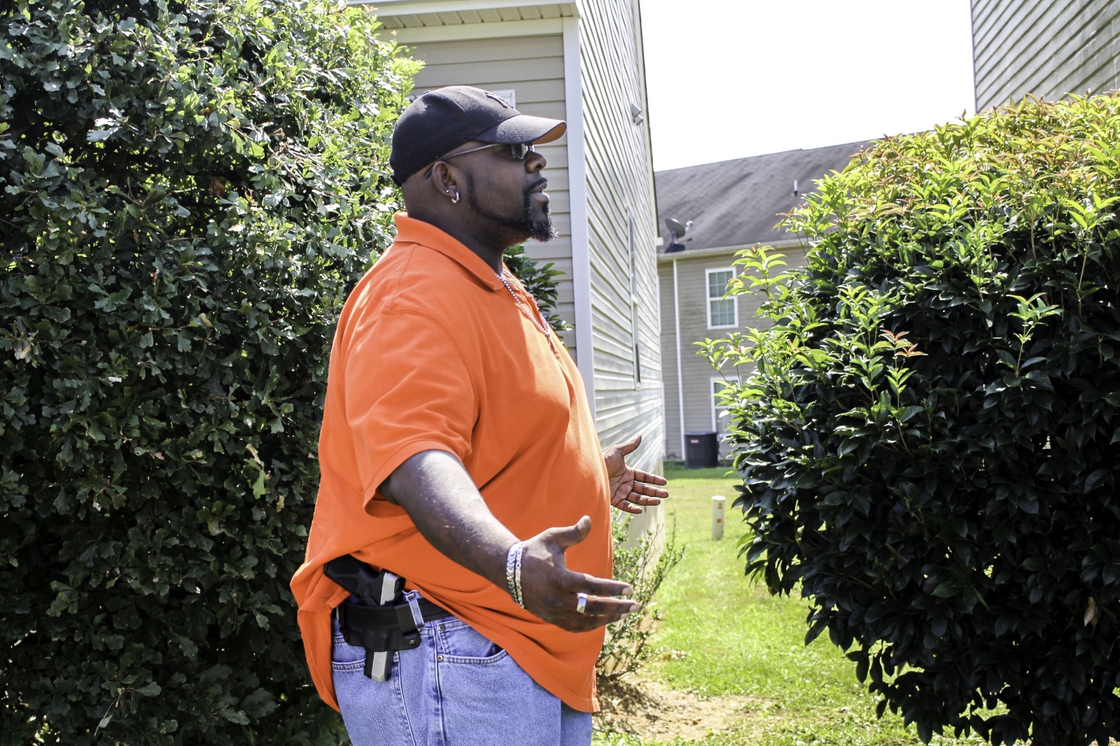Luther Thompson, 41, poses with his firearm outside his Cartersville, Ga. home on Sept. 6, 2020.