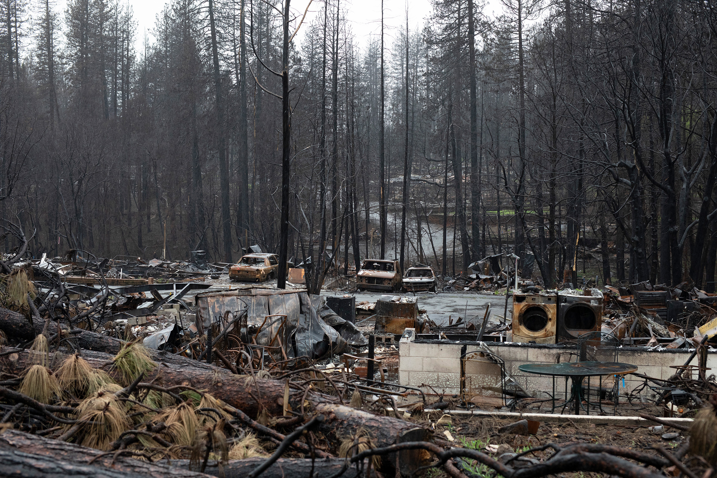 Burned down property in Paradise, strewn with debris