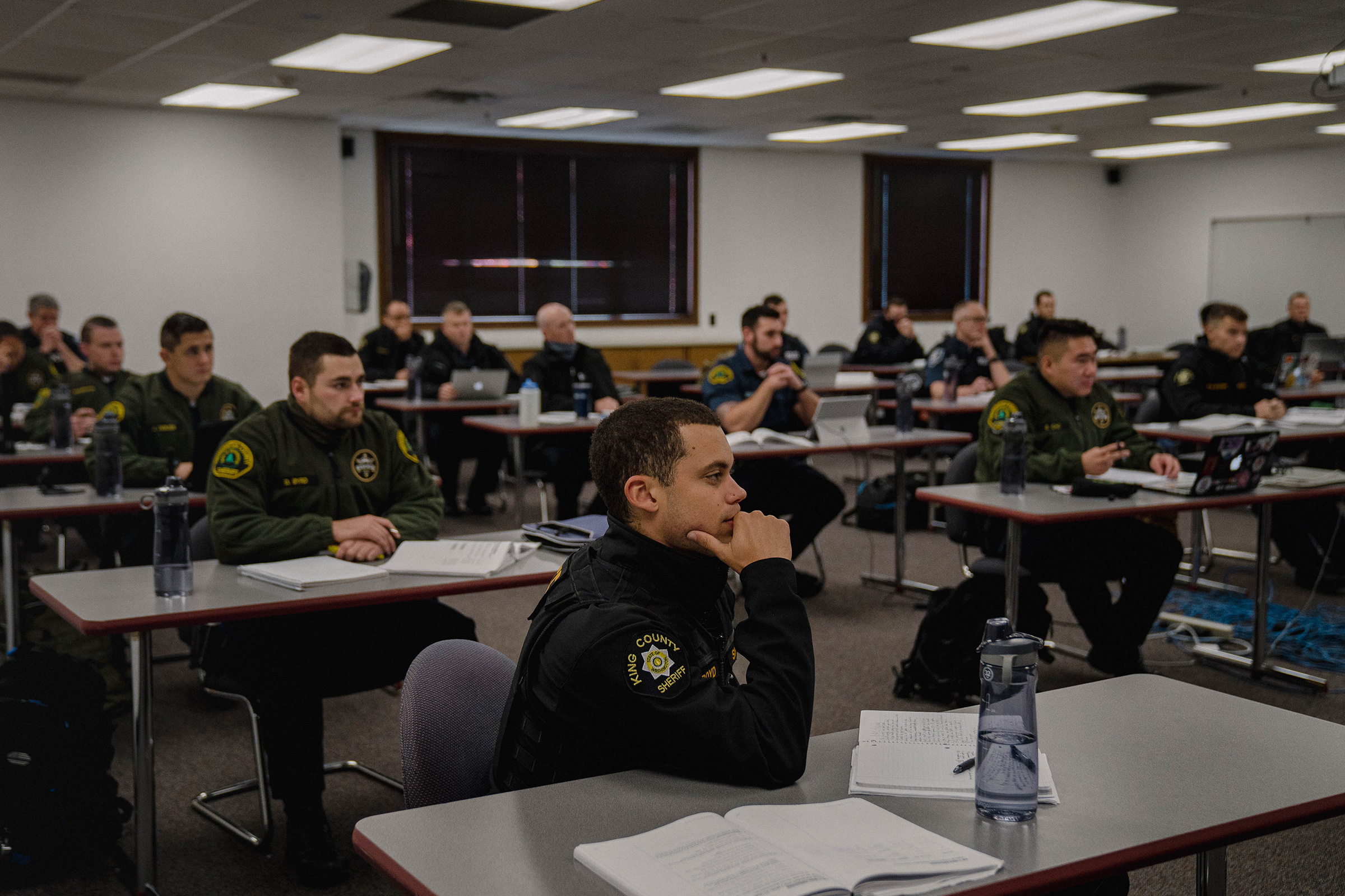 Police recruits attend a criminal law class.