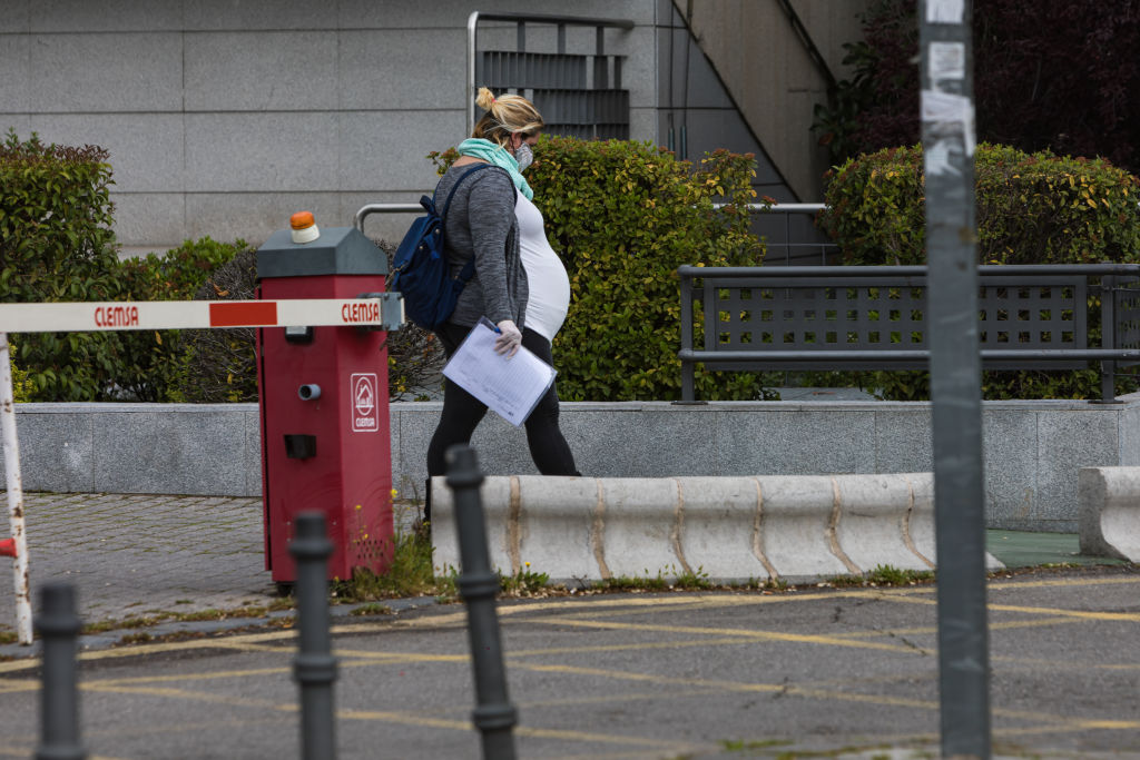 A pregnant woman wearing a face mask is seen at the La Paz University Hospital in Madrid, Spain on April 14, 2020. (David Benito—Getty Images)
