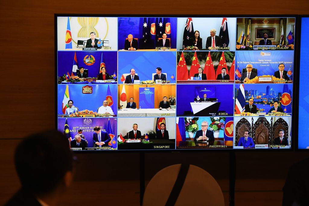 Representatives of signatory countries are pictured on screen during the signing ceremony for the Regional Comprehensive Economic Partnership (RCEP) trade pact at the ASEAN summit that is being held online in Hanoi on Nov. 15, 2020. (Nhac Nguyne&mdash;AFP/Getty Images)