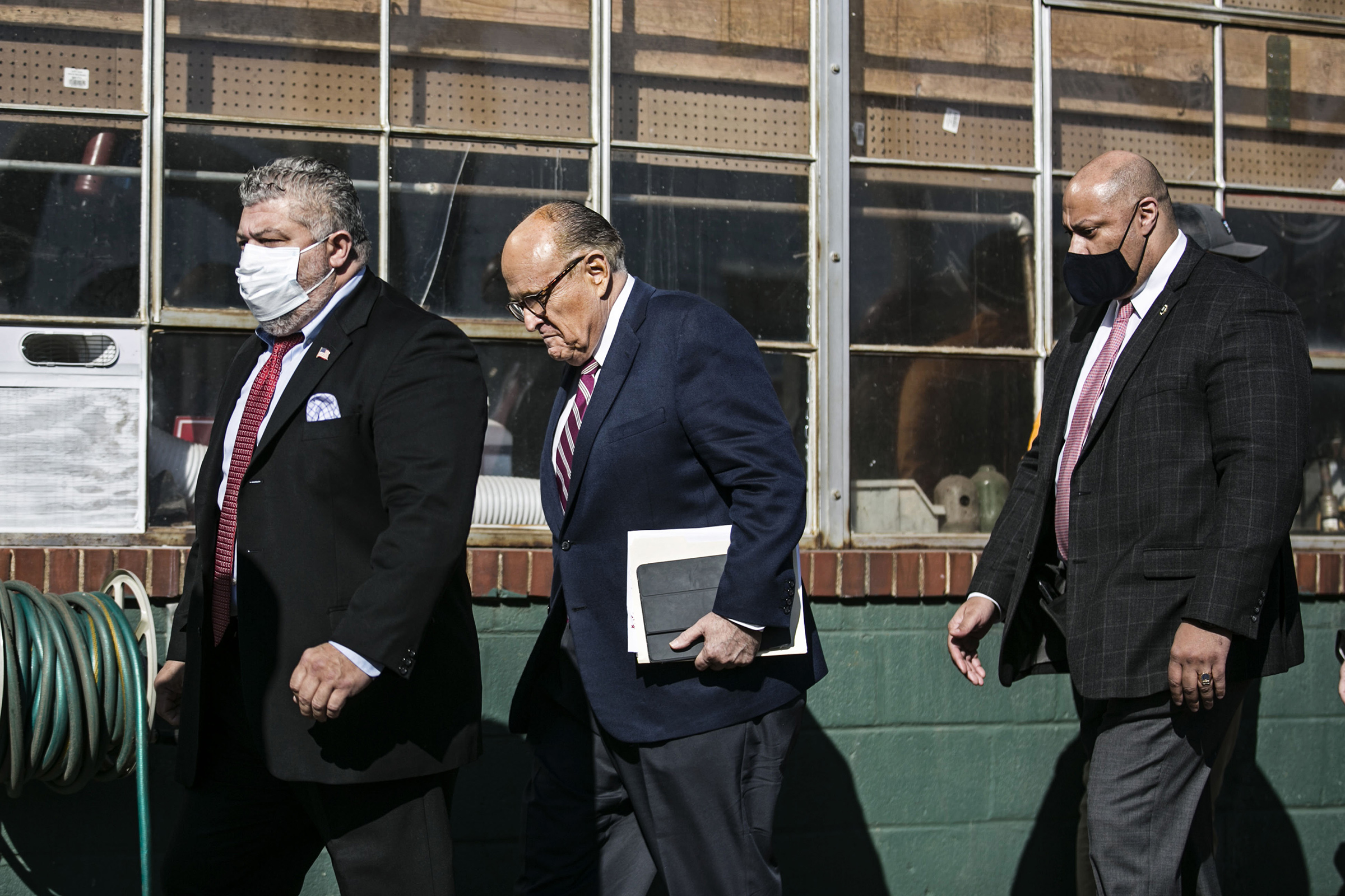 Rudy Giuliani arrives to a news conference in the parking lot of Four Seasons Total Landscaping in Philadelphia, on Nov. 7. (Pontus Höök—Aftonbladet/Sipa USA)