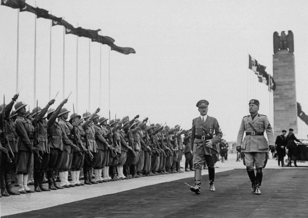 Adolf Hitler and Benito Mussolini walking past an honor guard in Rome in 1938 (The LIFE Picture Collection / Time Life Pictures / Getty Images)
