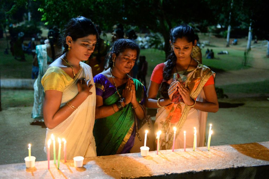 Members of the Telangana Transgender community hold a candlelight vigil to mark the 'Transgender Day of Remembrance', in Hyderabad on Nov. 20, 2019. (Noah Seelam—AFP/Getty Images)