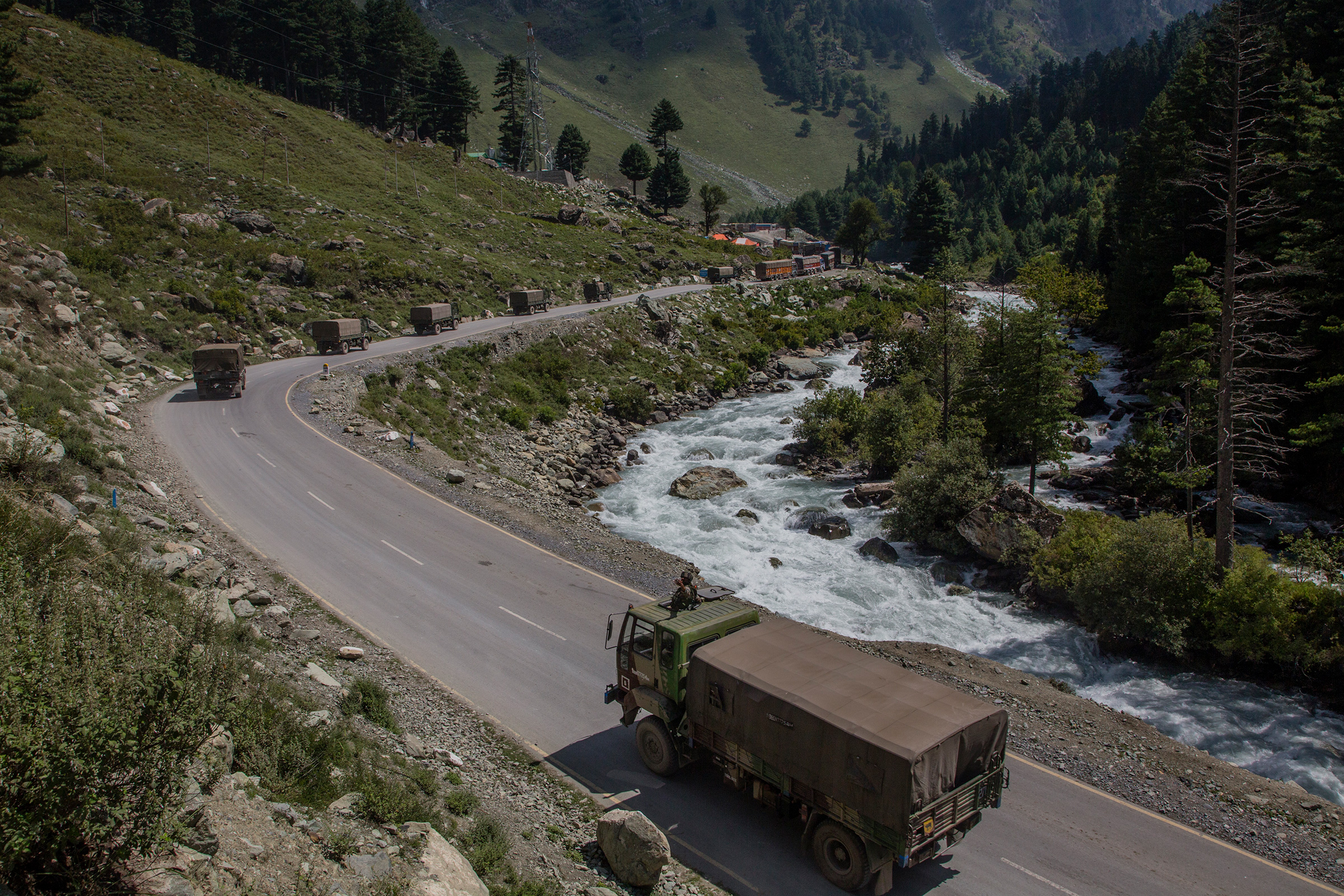 Indian army convoy drive towards Leh, on a highway bordering China, on Sept. 2 in Gagangir, India