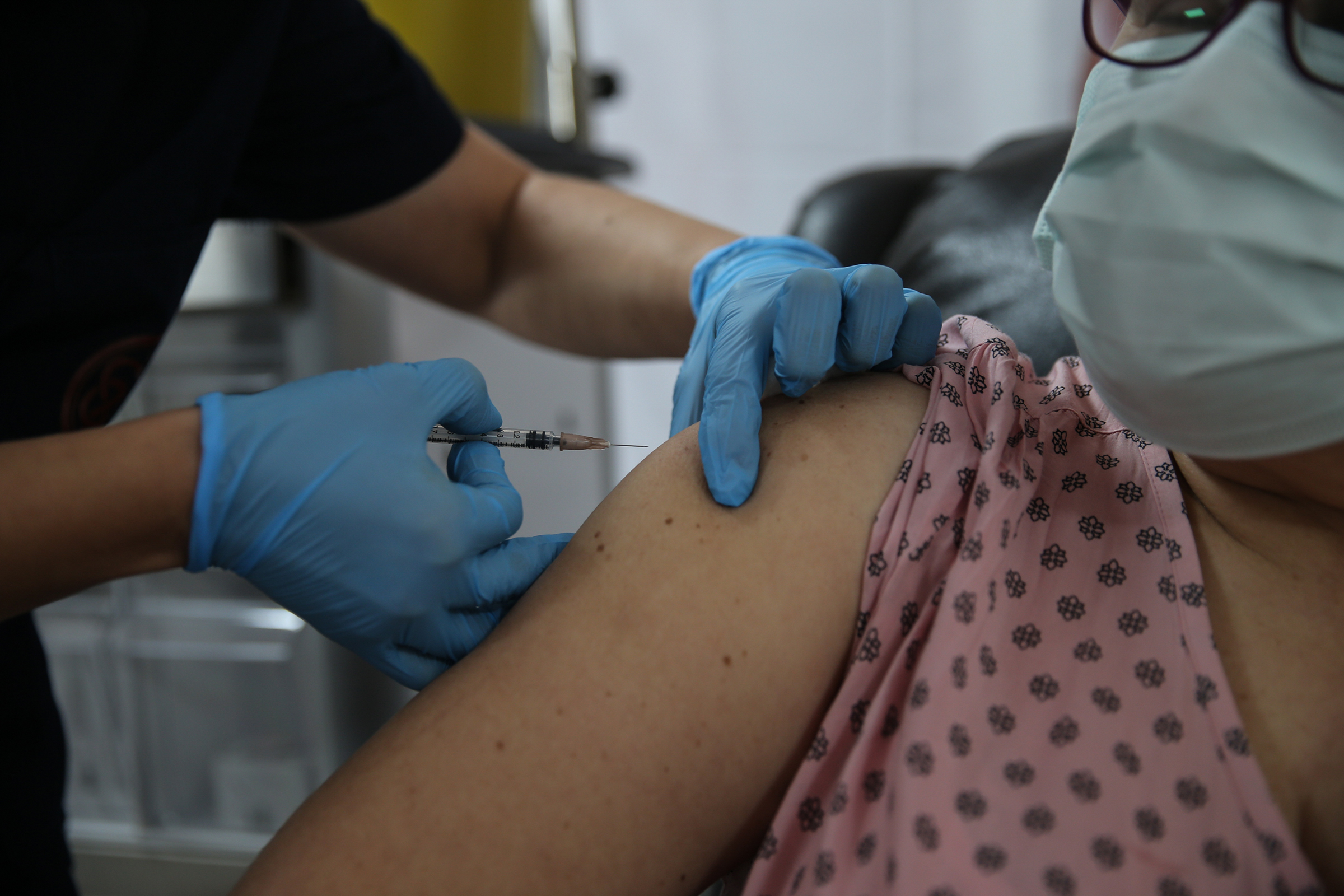 A volunteer gets a shot on Oct. 27 in the Phase 3 study of Pfizer’s vaccine candidate (Dogukan Keskinkilic—Anadolu Agency/Getty Images)