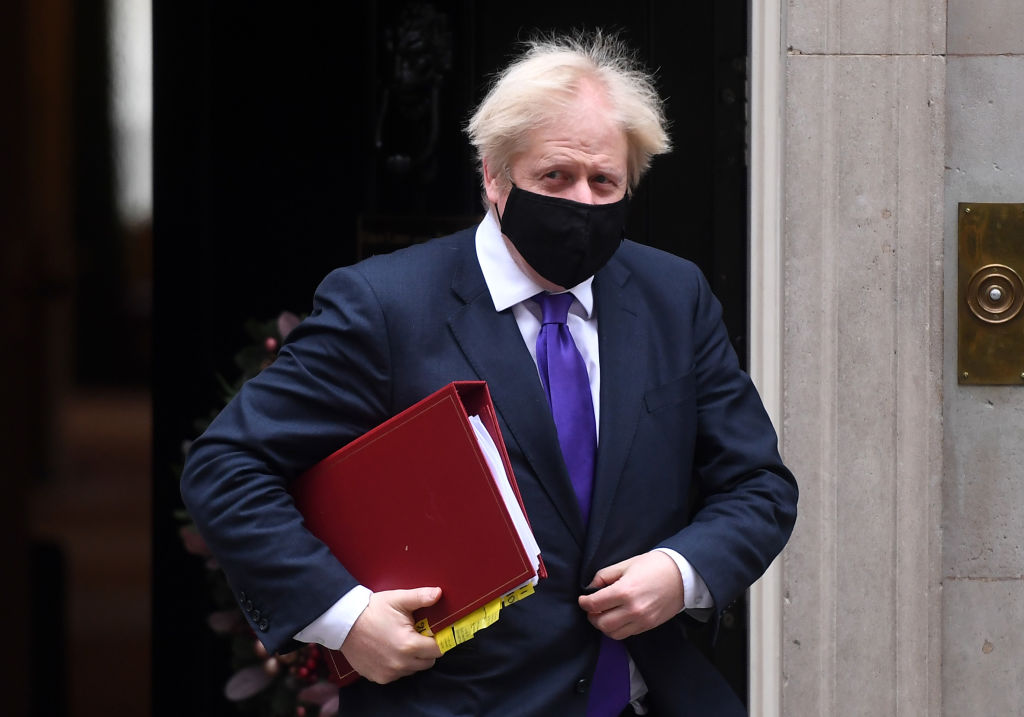 British Prime Minister Boris Johnson leaves 10 Downing Street after it was announced that the UK Government has approved the Pfizer/BioNTech Covid vaccine for use from next week, on December 2, 2020 in London, England. (Peter Summers – Getty Images)
