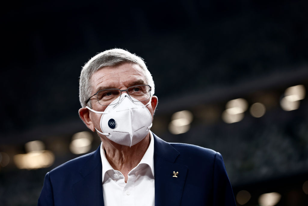 International Olympic Committee President Thomas Bach, wearing a face mask, speaks to the media during a visit to the National Stadium, main venue for the postponed Tokyo 2020 Olympic and Paralympic Games, on November 17, 2020 in Tokyo, Japan. (Behrouz Mehri-Pool/Getty Images)