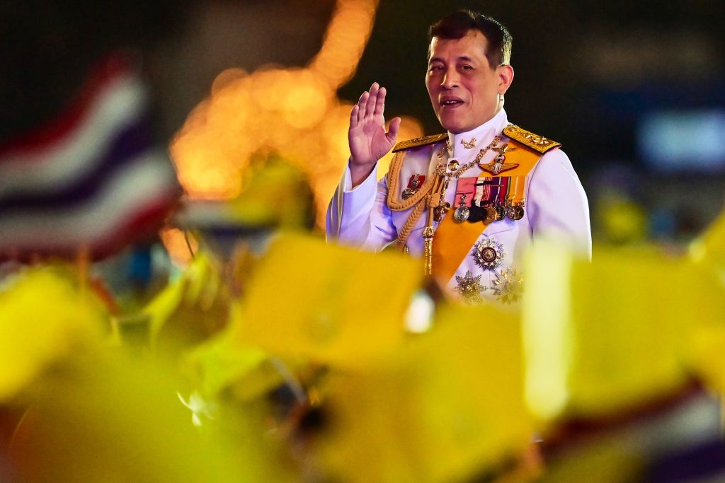 Thailand's King Maha Vajiralongkorn waves to royalist supporters during a ceremony to commemorate the birthday of his father the late Thai king Bhumibol Adulyadej at Sanam Luang in Bangkok on December 5, 2020. (LILLIAN SUWANRUMPHA/AFP via Getty Images)
