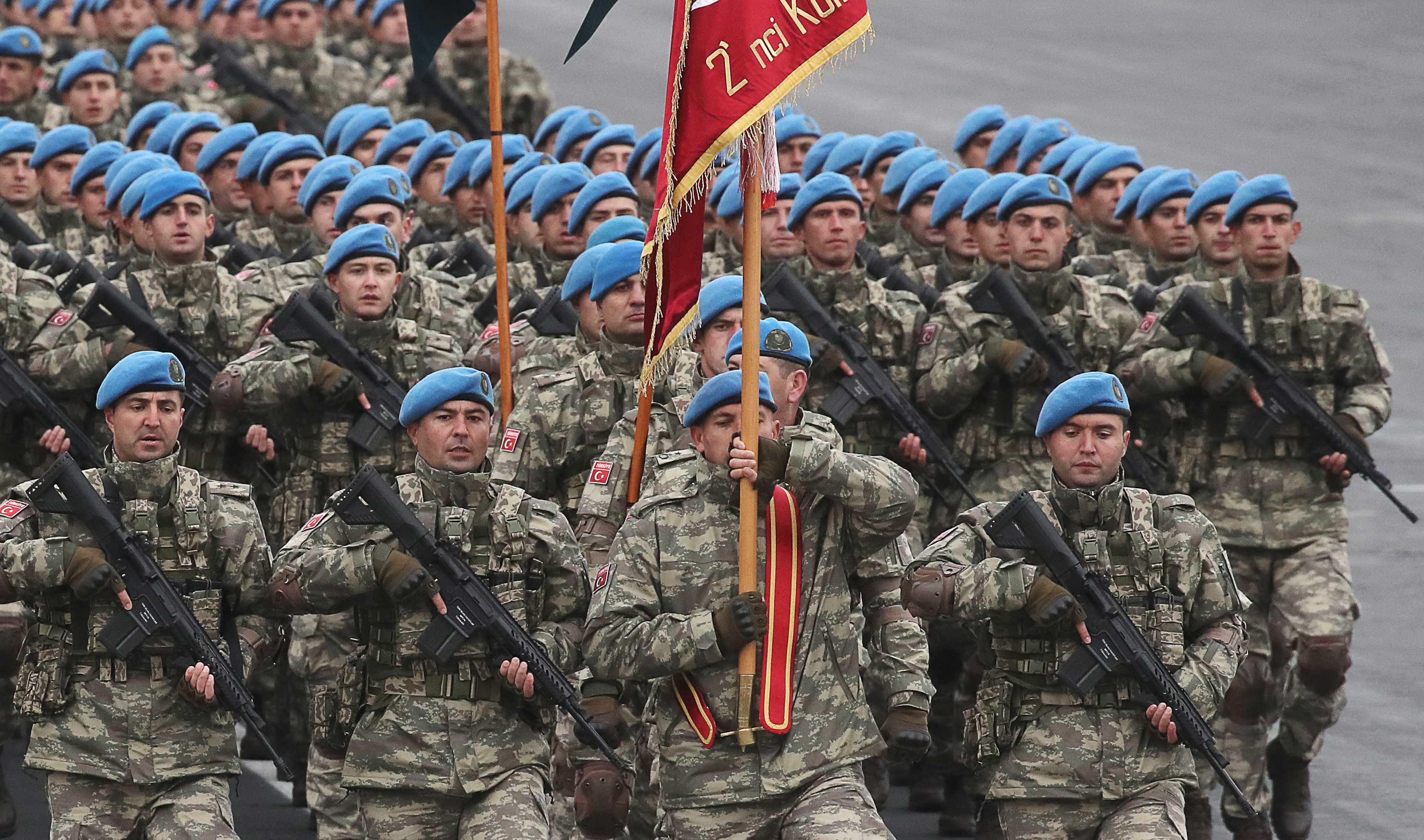 Turkish soldiers march in formation during a military parade marking the end of the Nagorno Karabakh military conflict. (Valery Sharifulin—TASS/Getty Images)
